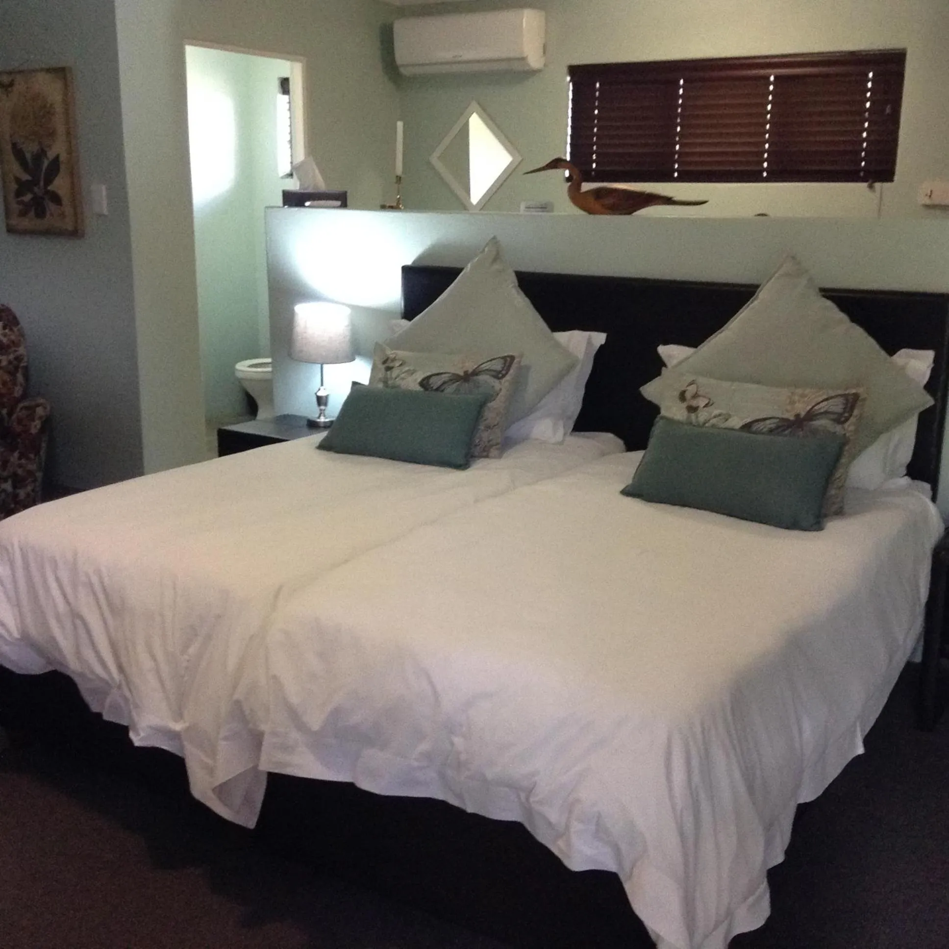 Bed in Gerald's Gift Guest House