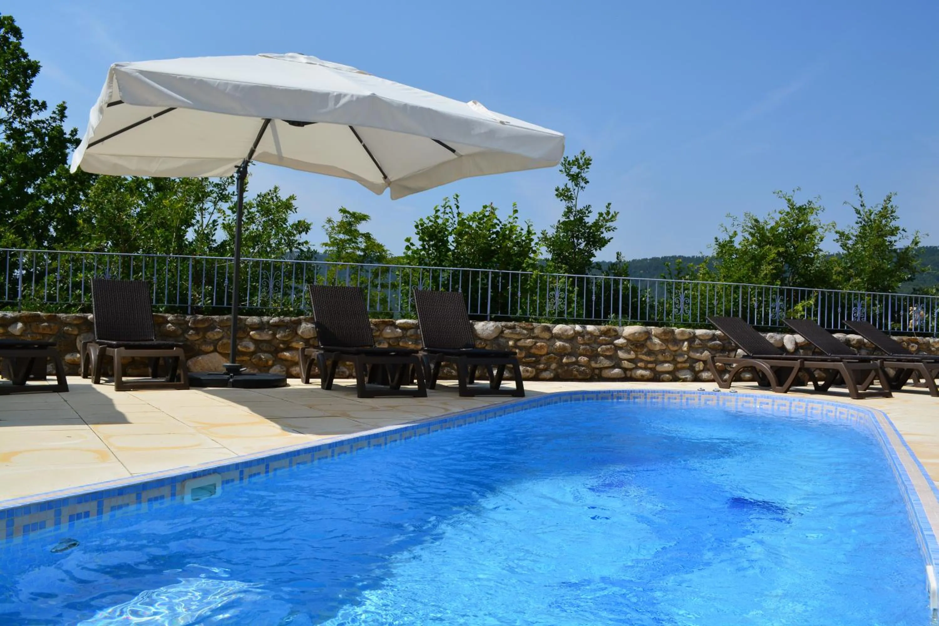 Swimming pool in Hôtel Le Colombier