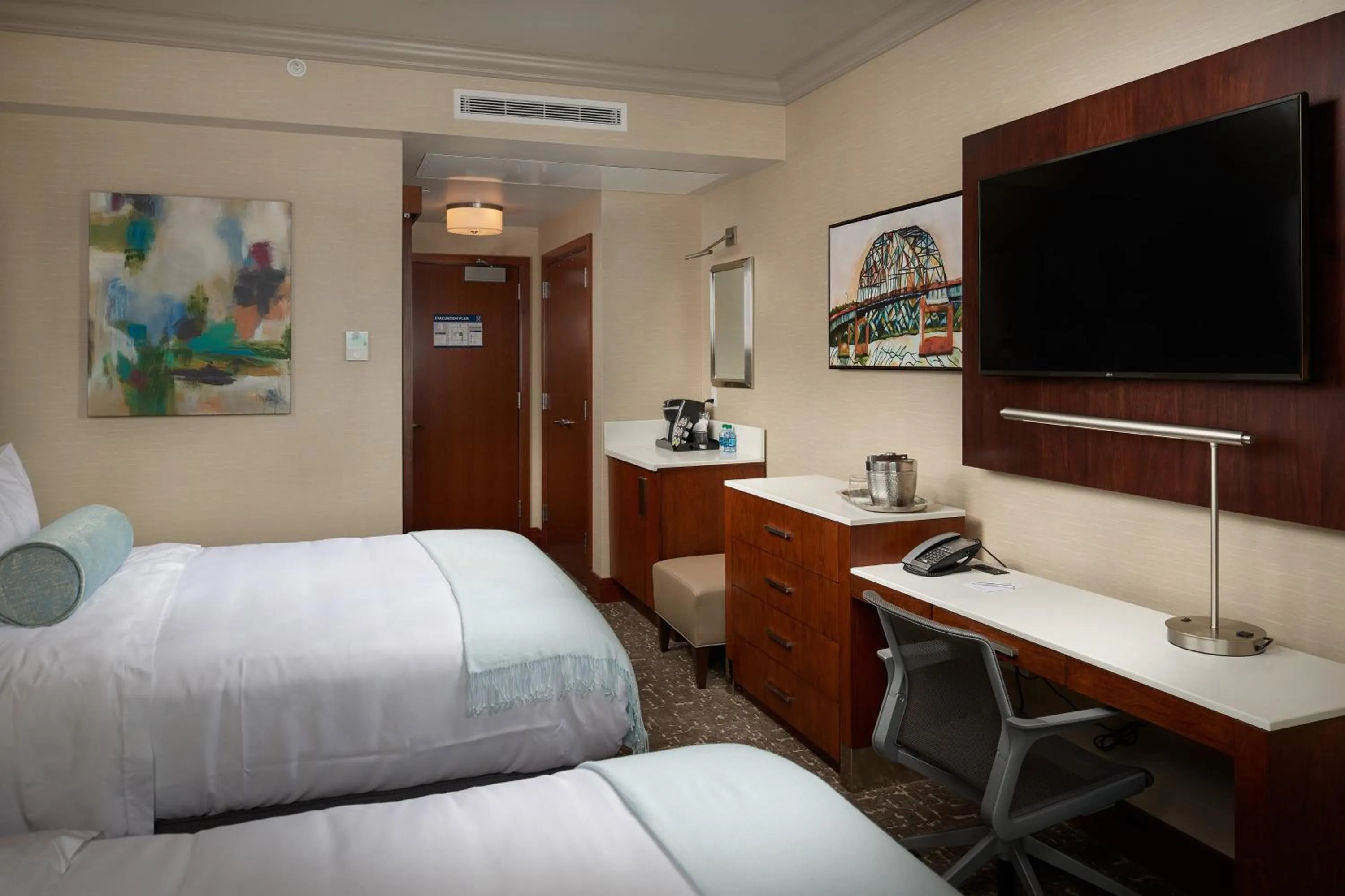 Photo of the whole room, Bed in The Merrill Hotel & Conference Center, Muscatine, a Tribute Portfolio Hotel