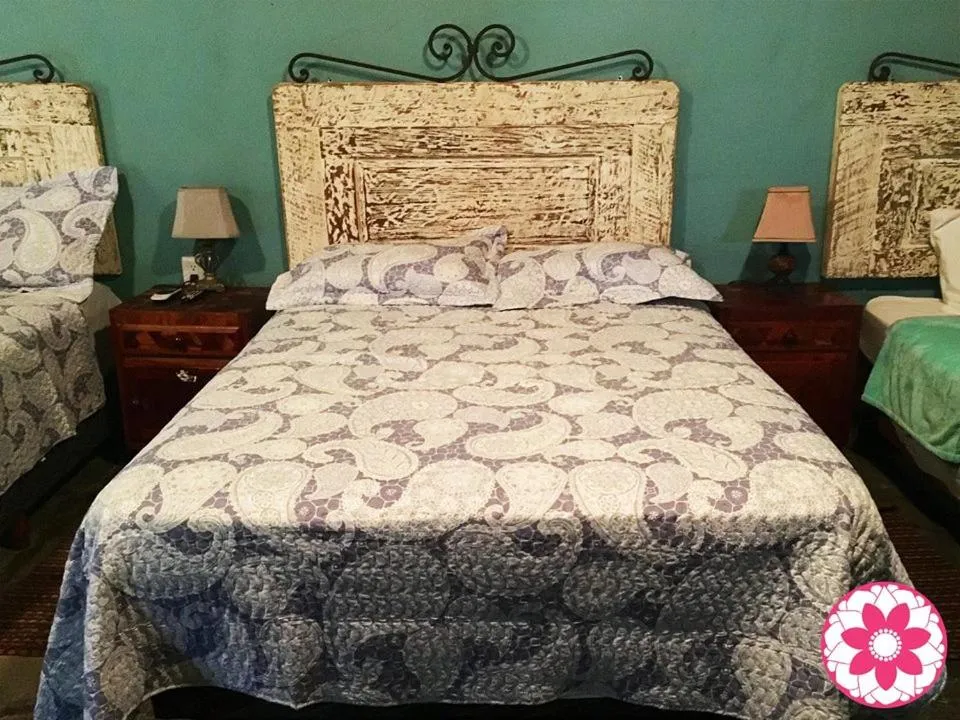 Bed in Hostal Doña Carlota Hotel