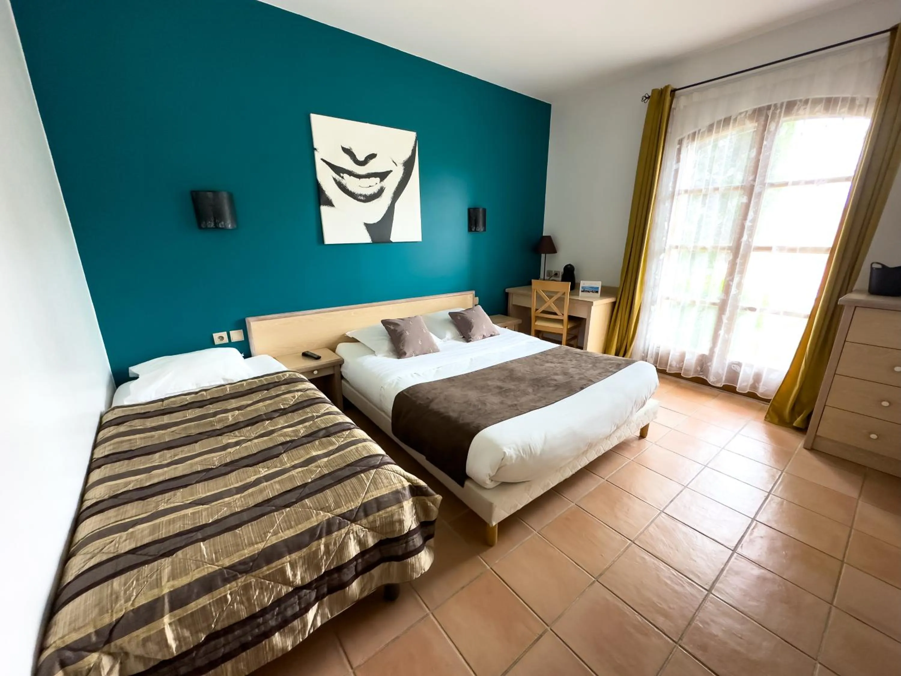 Bed in Hôtel et Restaurant Logis Le Mas de Mon Père