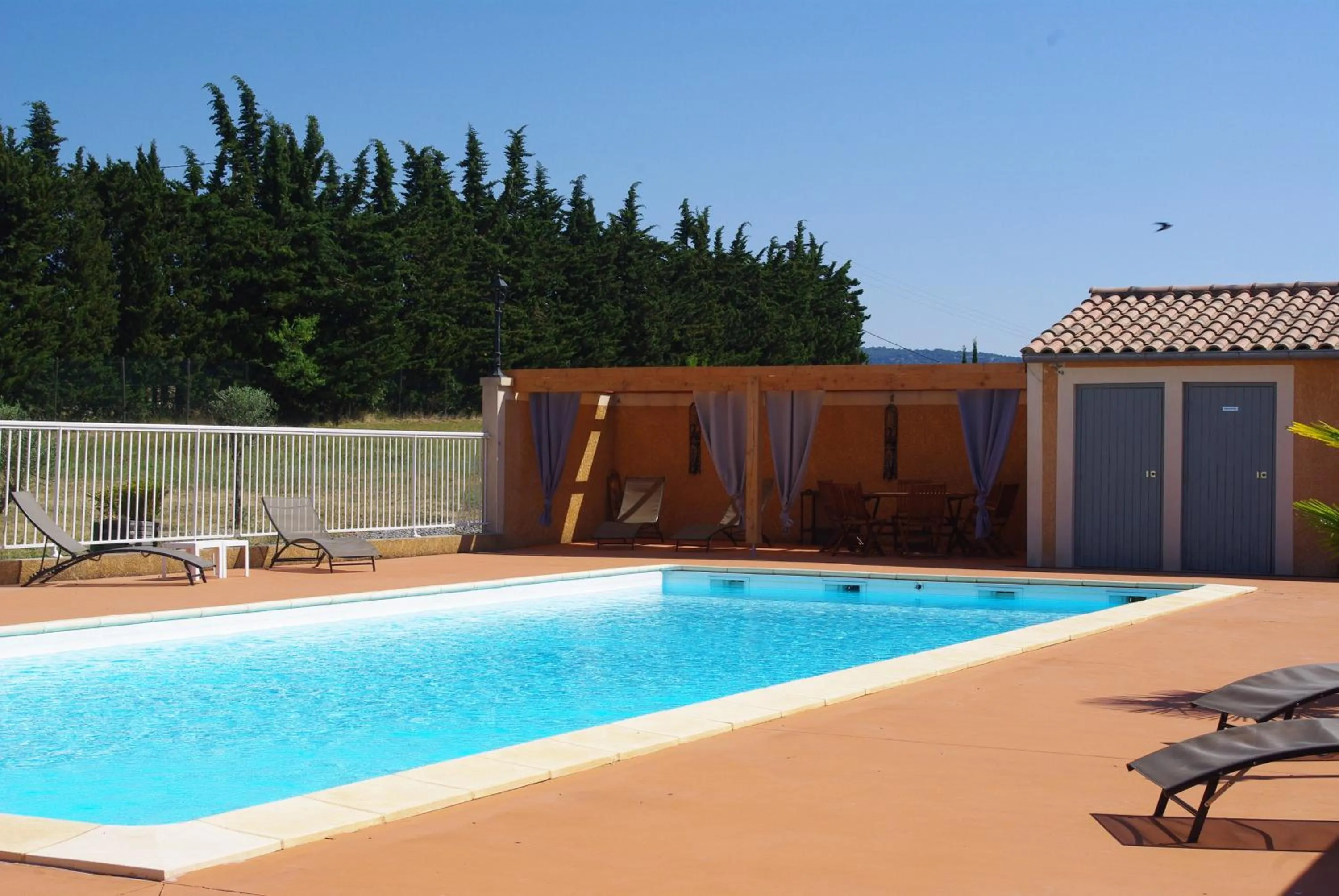 Swimming pool in Hôtel et Restaurant Logis Le Mas de Mon Père