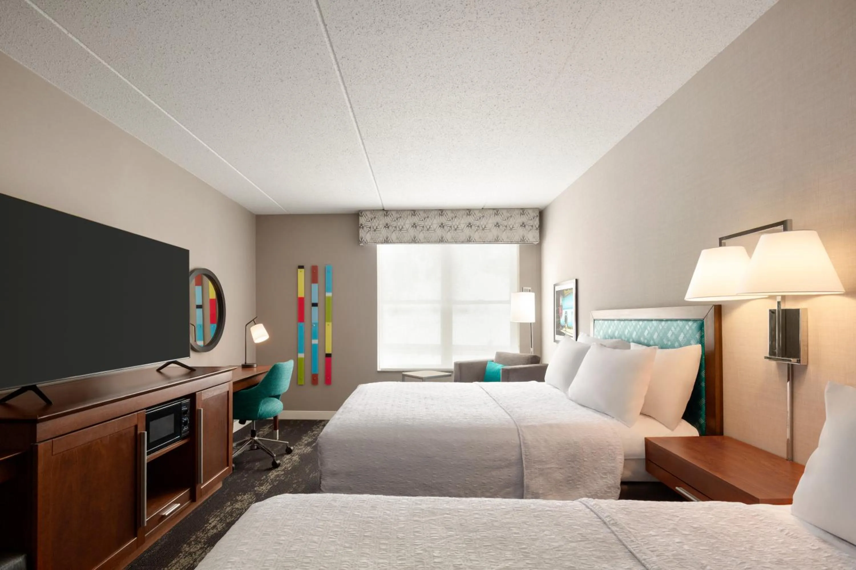 Bed in Hampton Inn at Tin Lizzie Gaming Resort