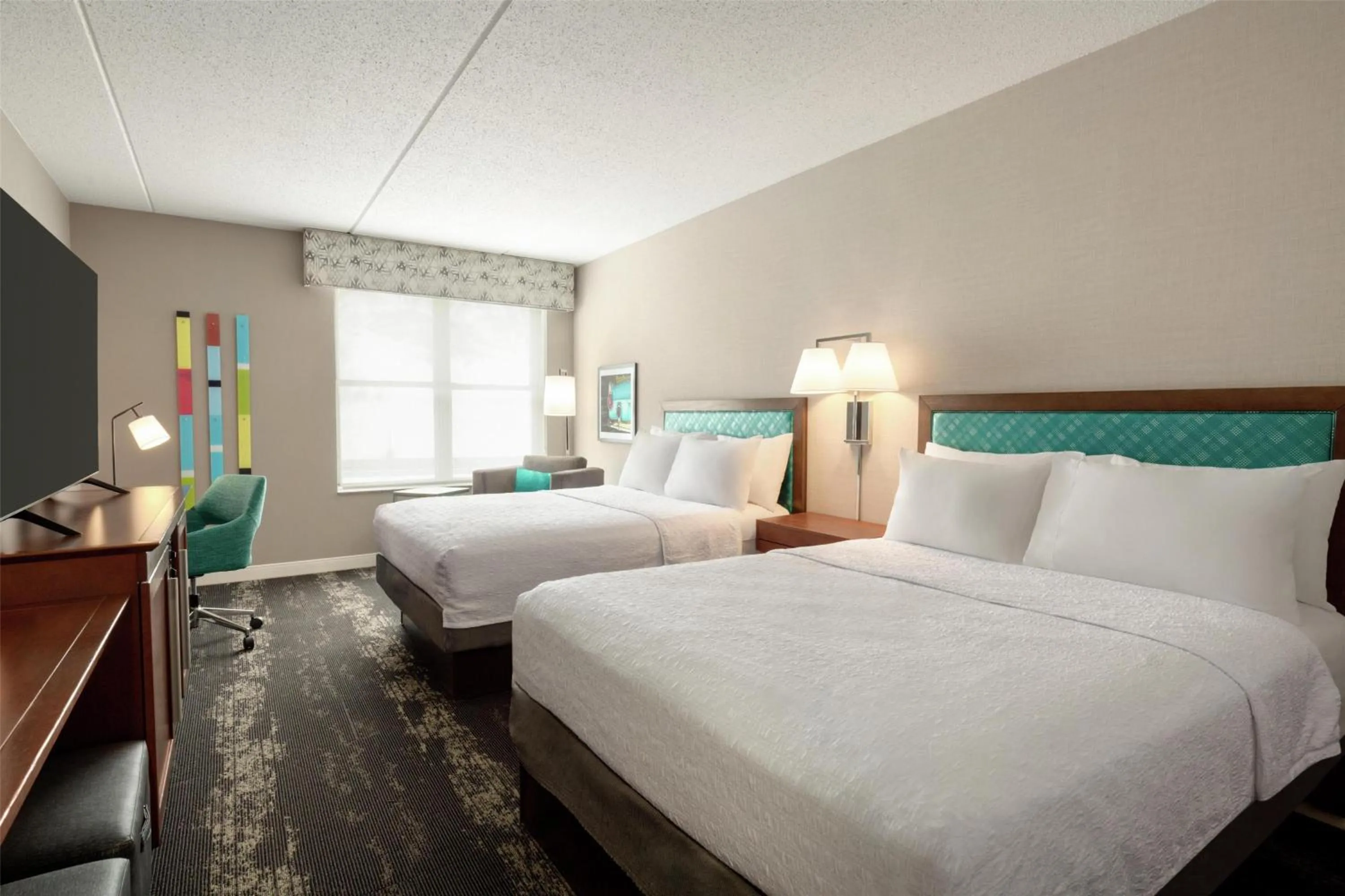 Bed in Hampton Inn at Tin Lizzie Gaming Resort