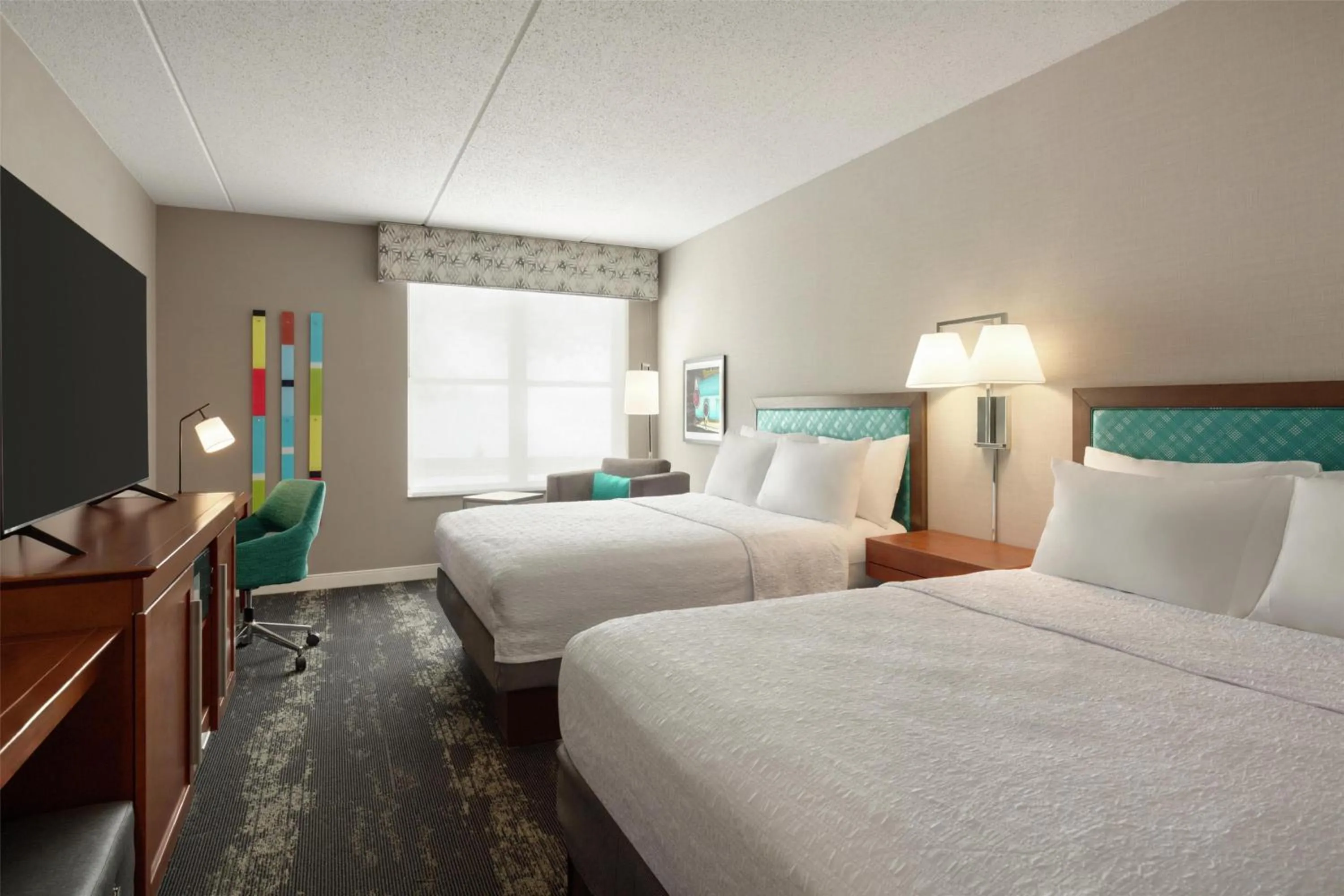 Bed in Hampton Inn at Tin Lizzie Gaming Resort