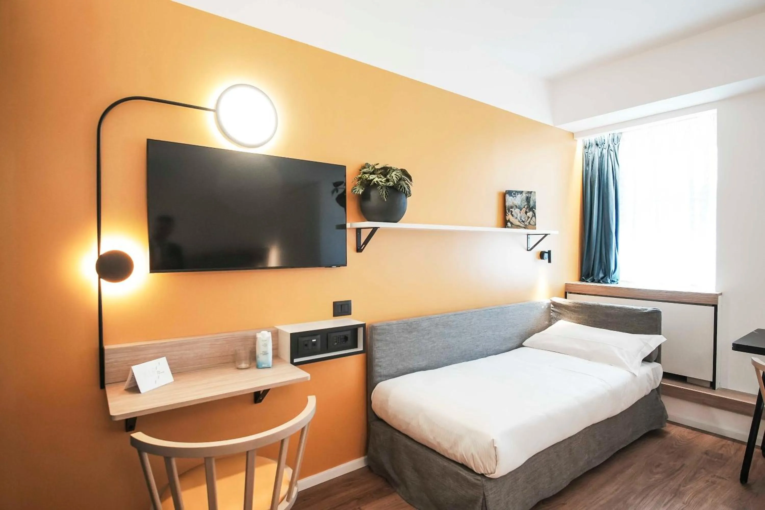 Bed in Aparthotel Colombo Roma