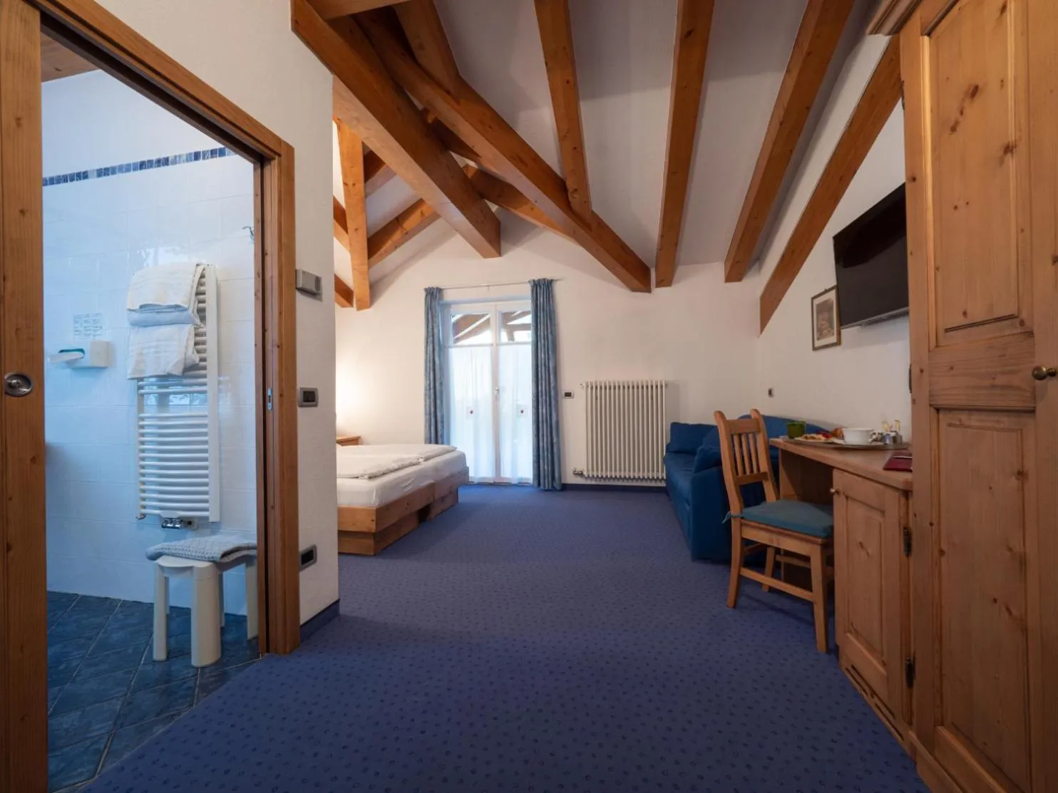 Bed in Hotel Garni Sottobosco