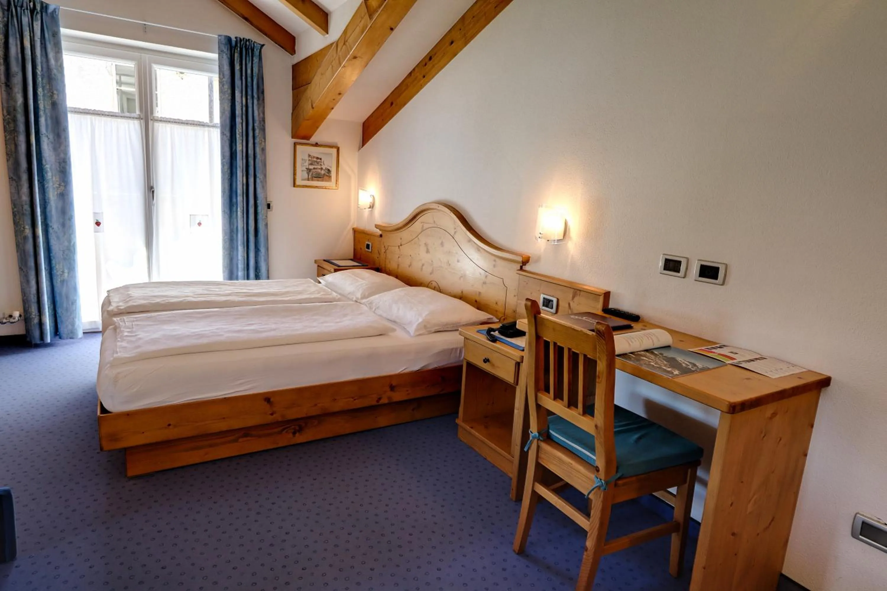 Bed in Hotel Garni Sottobosco