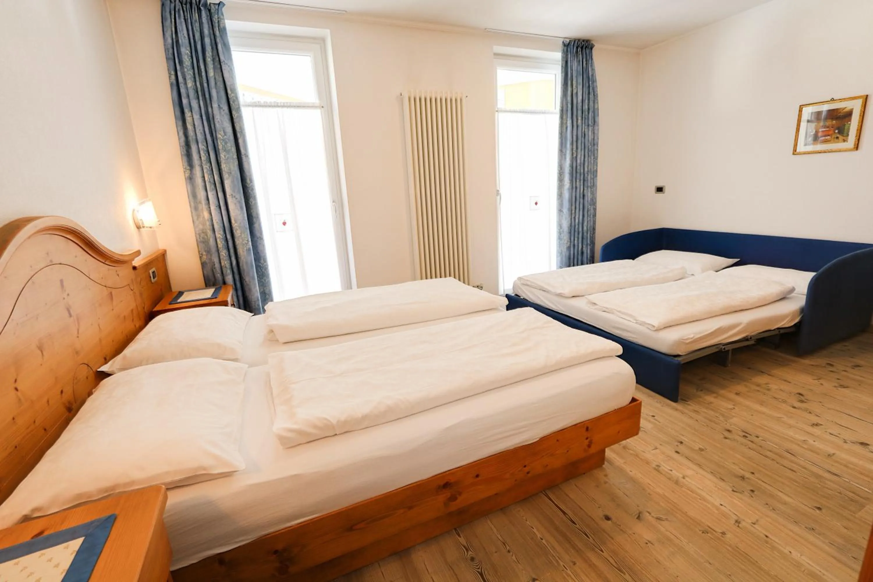 Bed in Hotel Garni Sottobosco