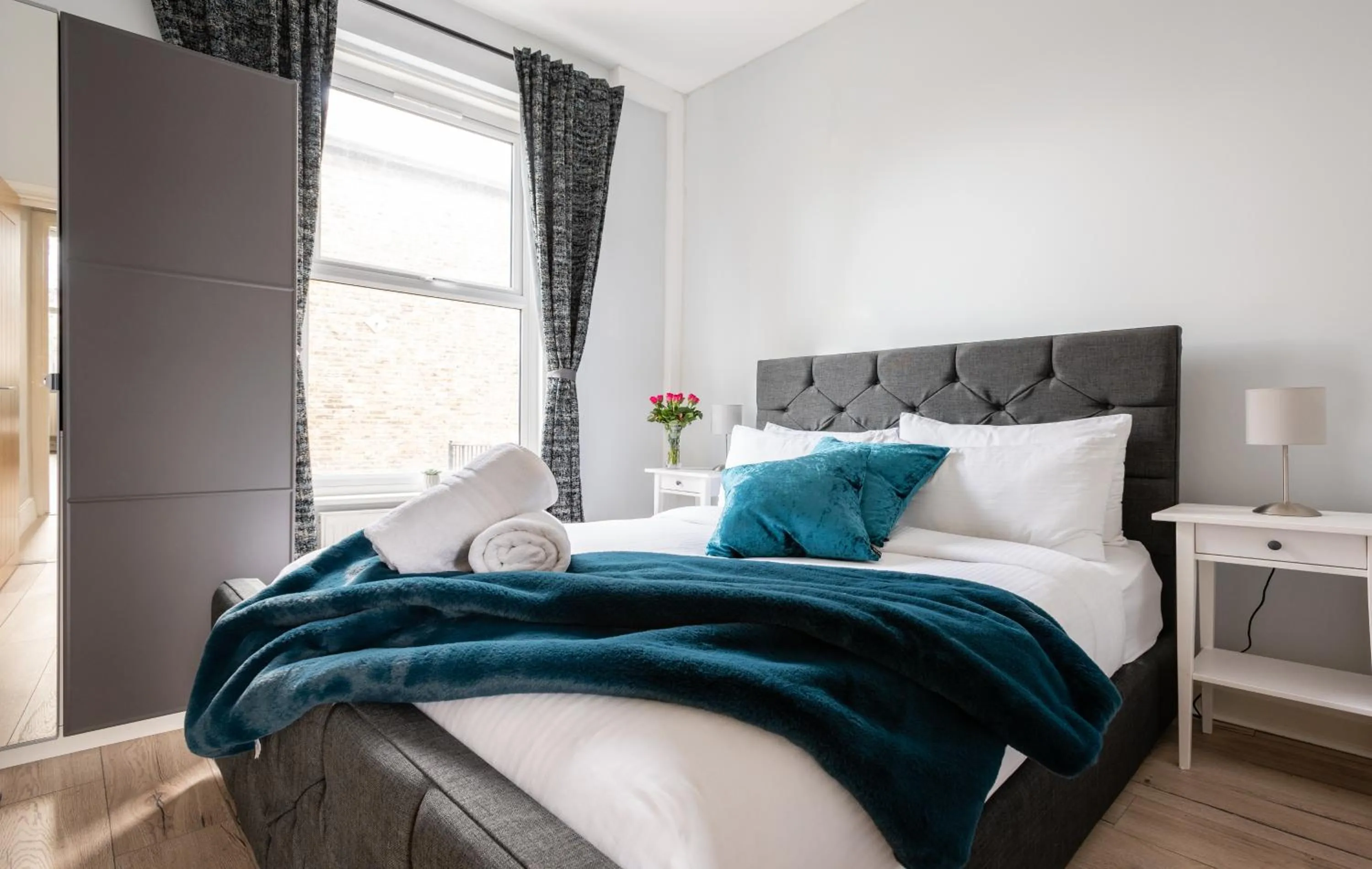 Bed in The Love Walk Apartments