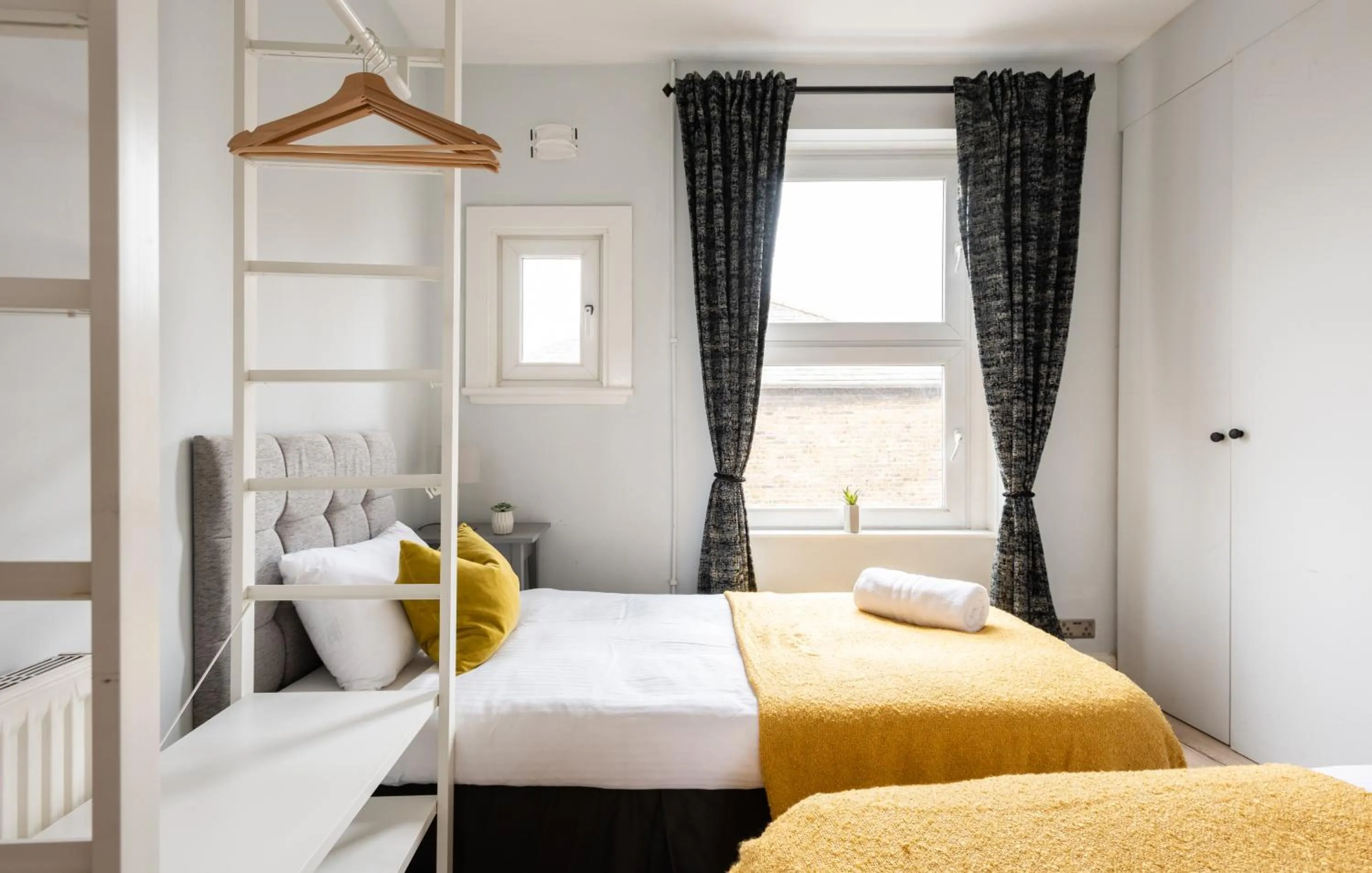 Bed in The Love Walk Apartments