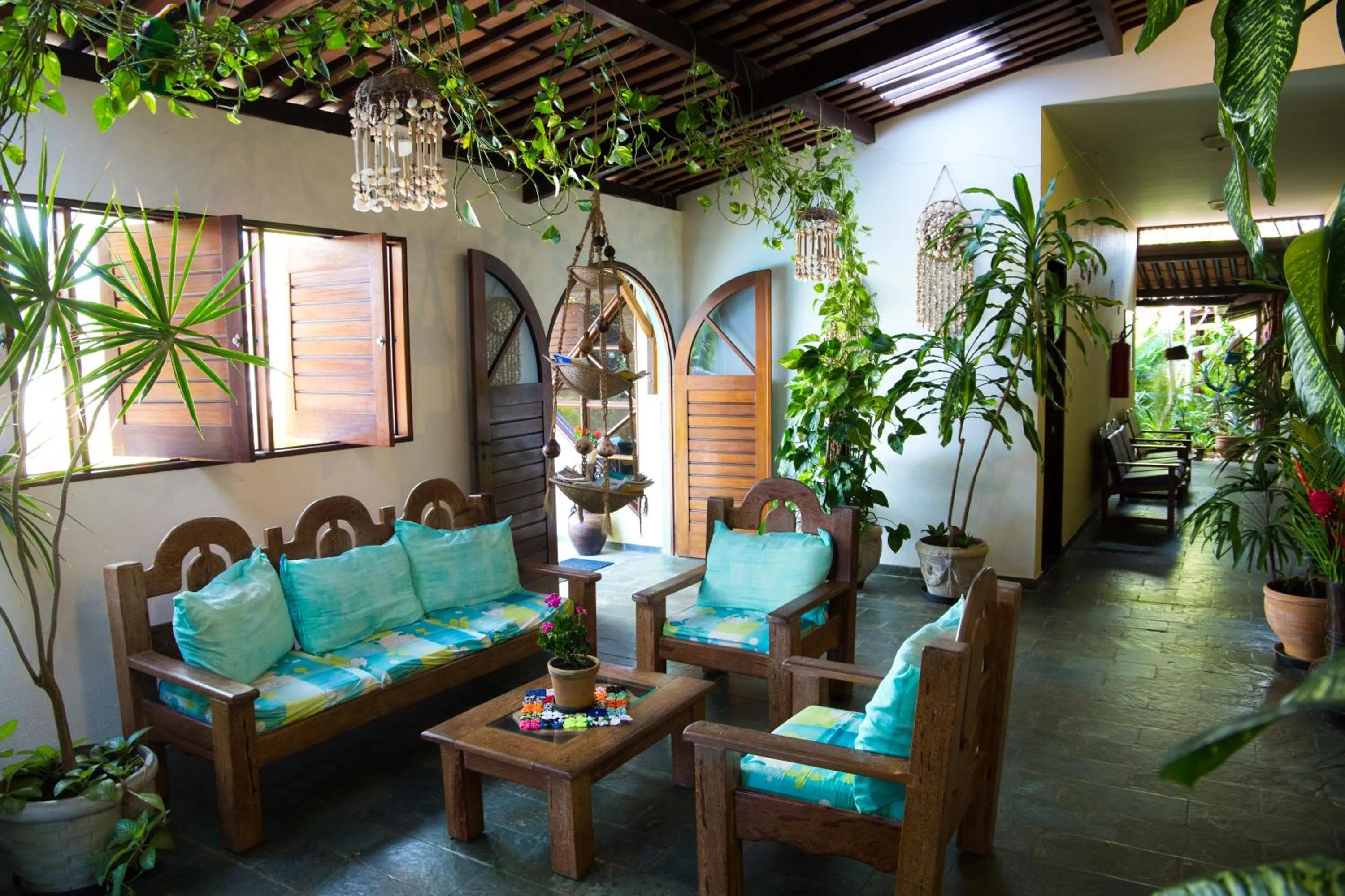 Communal lounge/ TV room in Hotel Pousada Arco Iris