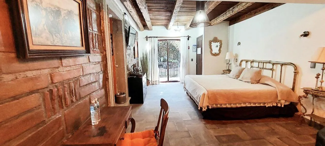 Photo of the whole room, Bed in Posada de la Virgen