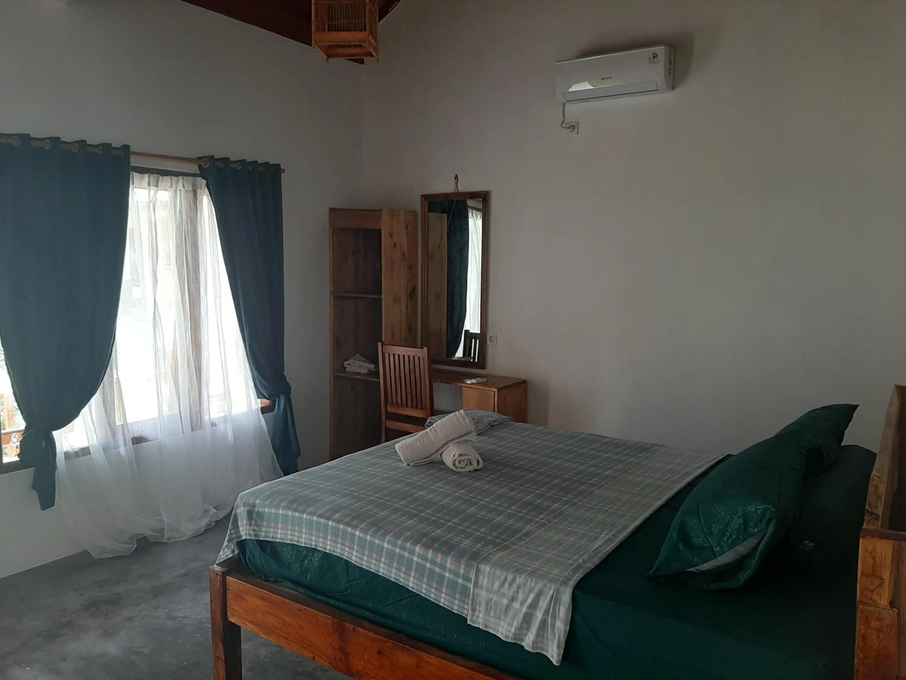 Bed in Kambuna Bungalow