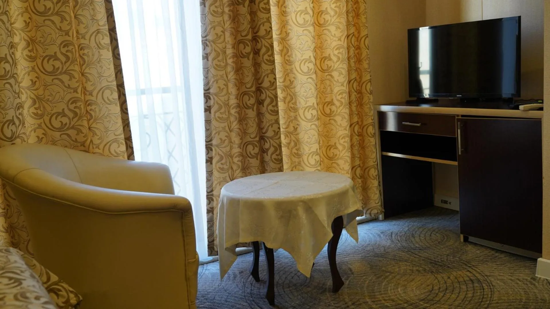 Communal lounge/ TV room in Premier Hotel