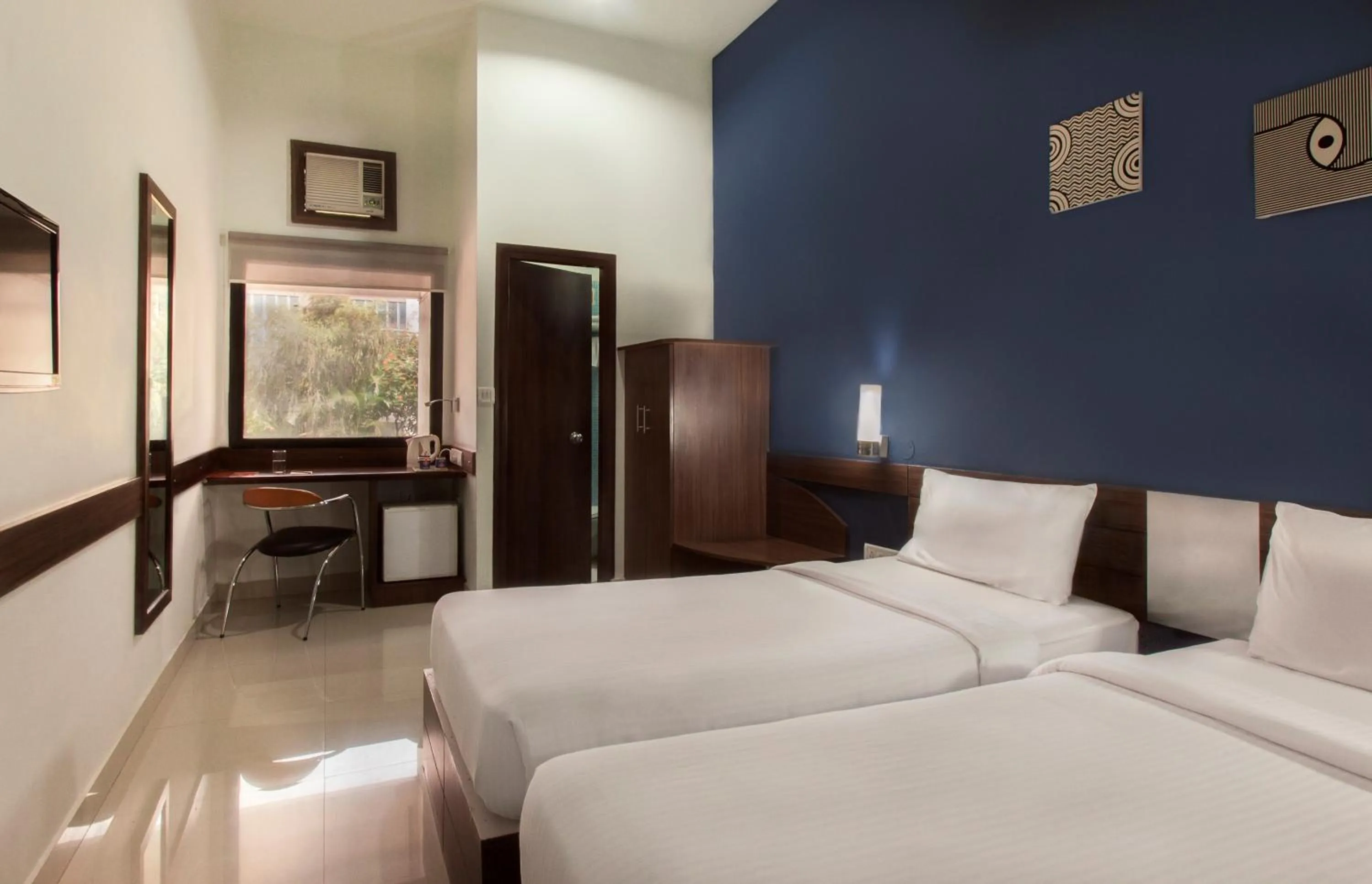 Photo of the whole room, Bed in Ginger Guwahati