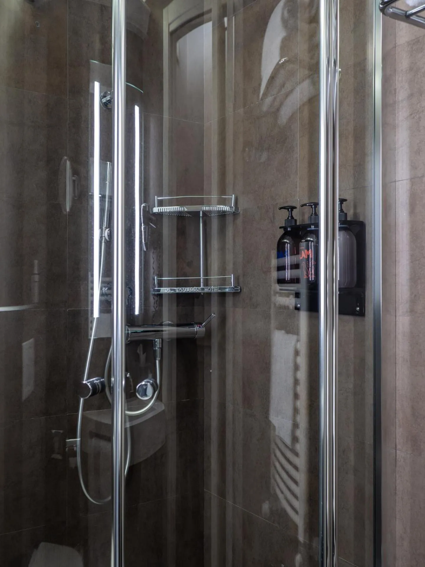 Shower in The Glam Boutique Hotel & Apt