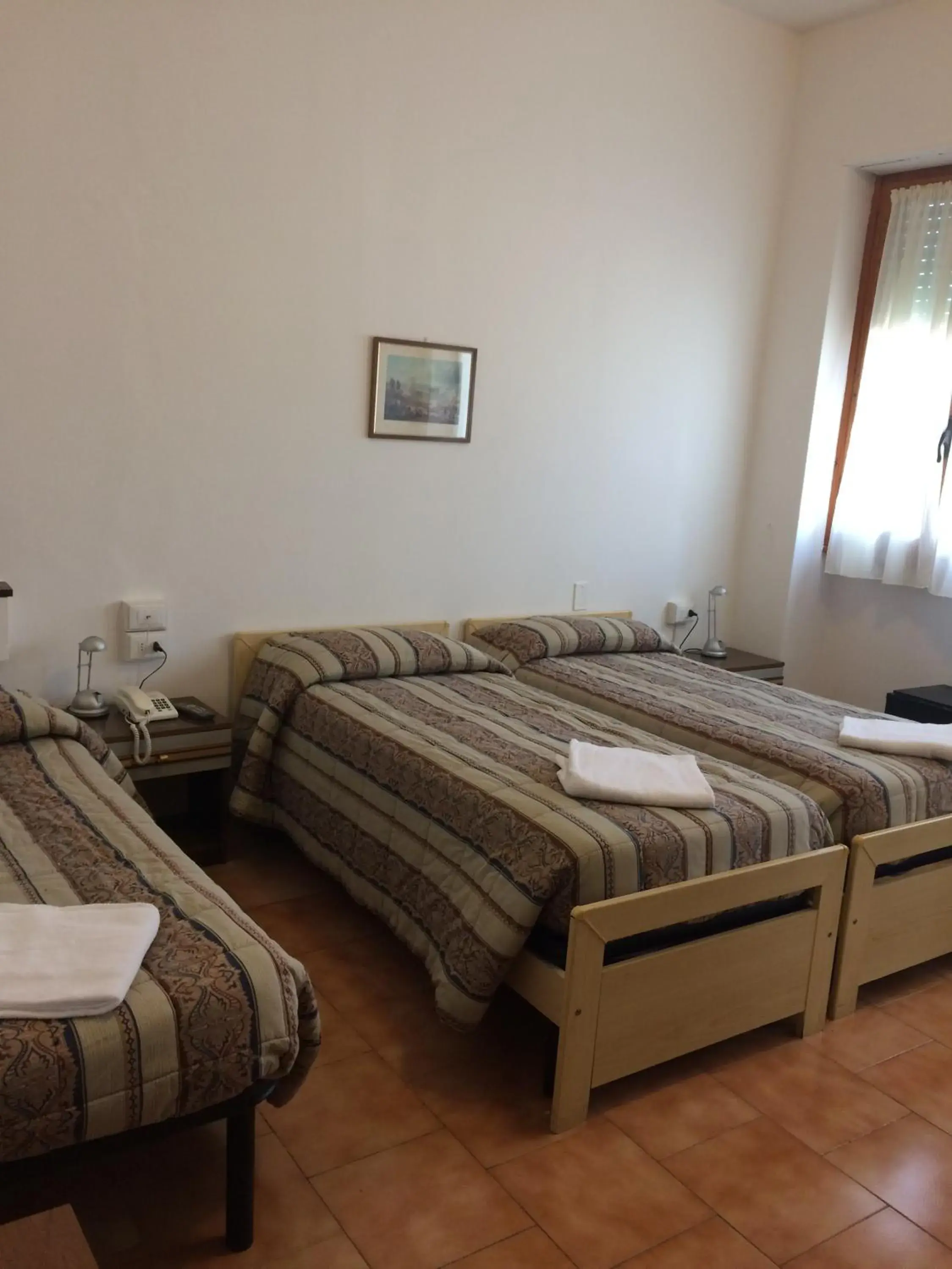 Triple Room in Hotel Bodoni Triple Room in Hotel Bodoni