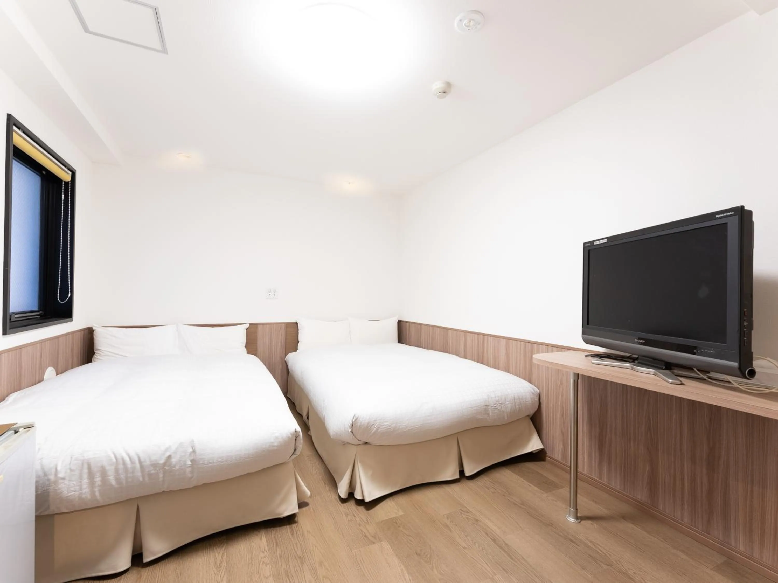 Bed in Chang Tee Hotel Ikebukuro