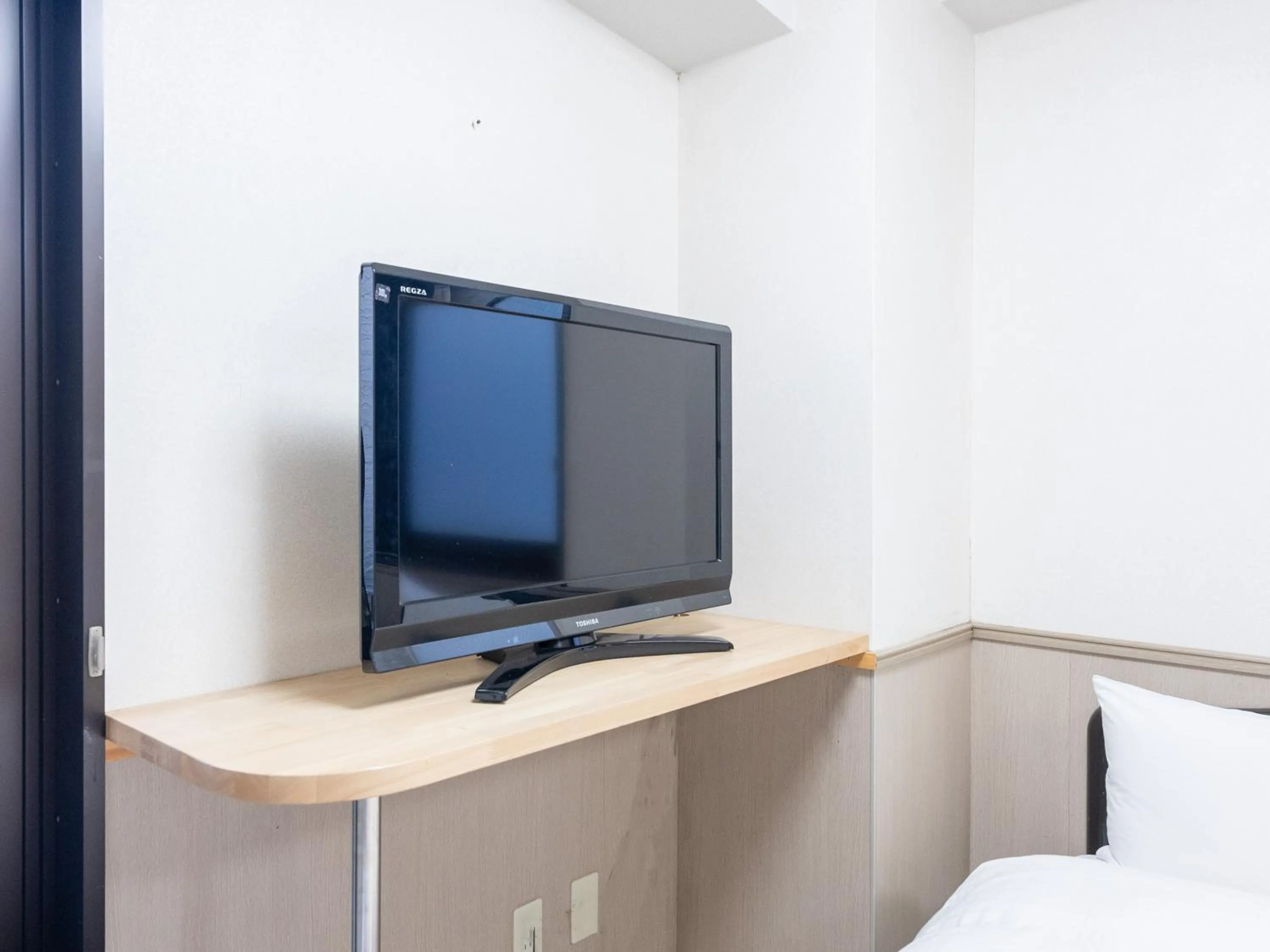 Bed in Chang Tee Hotel Ikebukuro