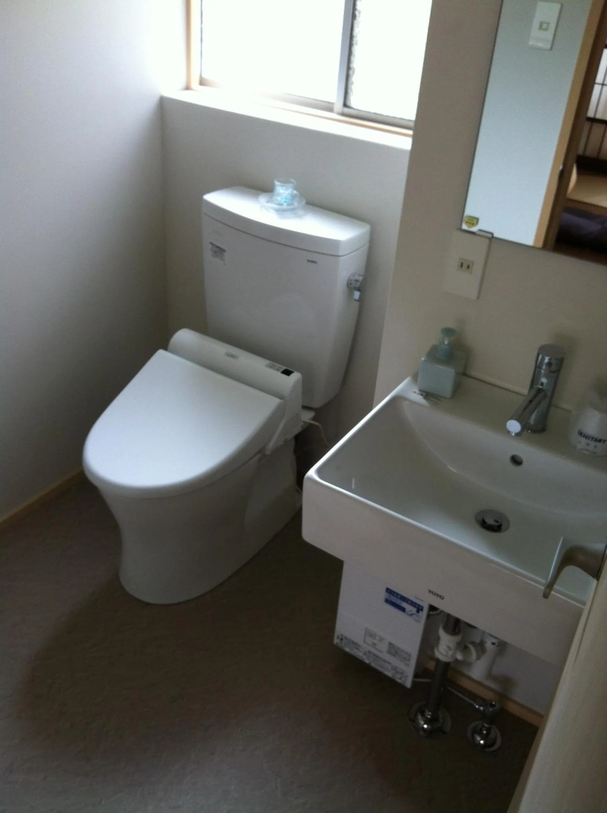 Toilet in IZUYASU Traditional Kyoto Inn serving Kyoto cuisine