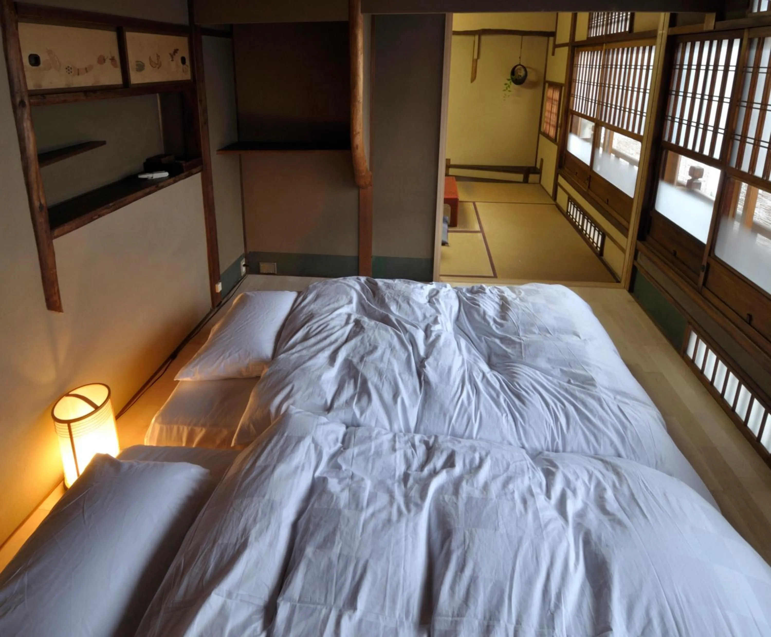 Bed in IZUYASU Traditional Kyoto Inn serving Kyoto cuisine