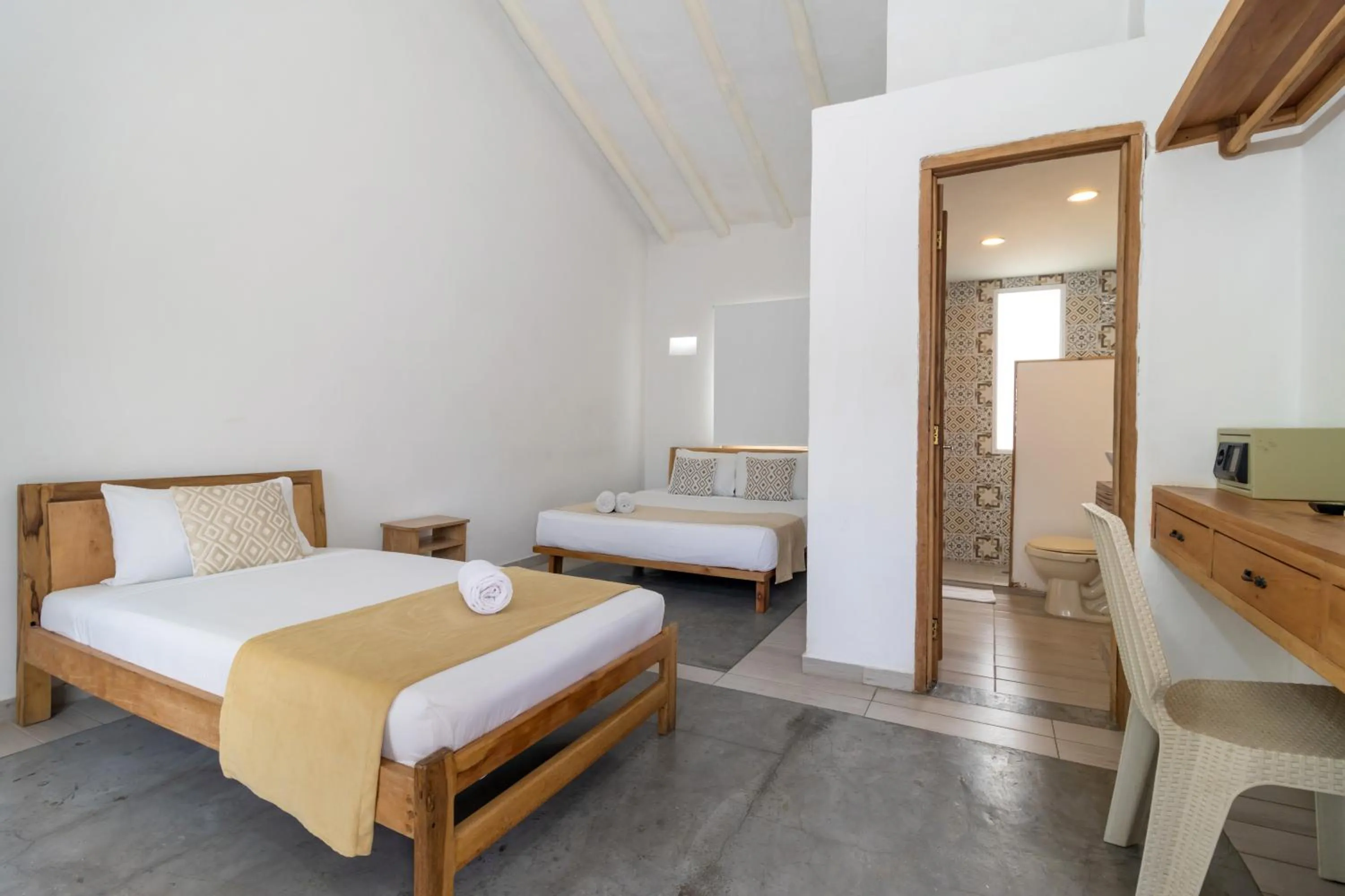 Property building, Bed in Hotel Sansiraka Suites By GEH Suites