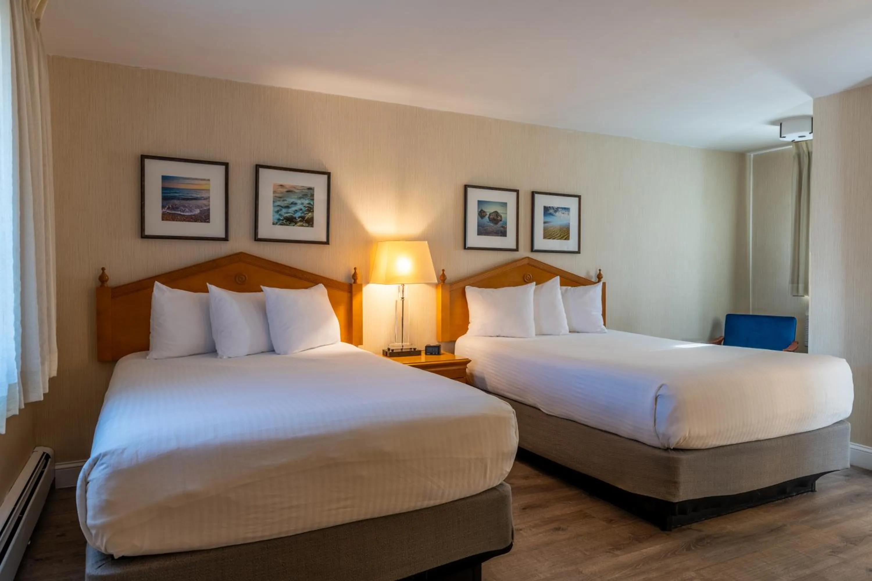 Bed in Port Inn and Suites Portsmouth, an Ascend Collection Hotel