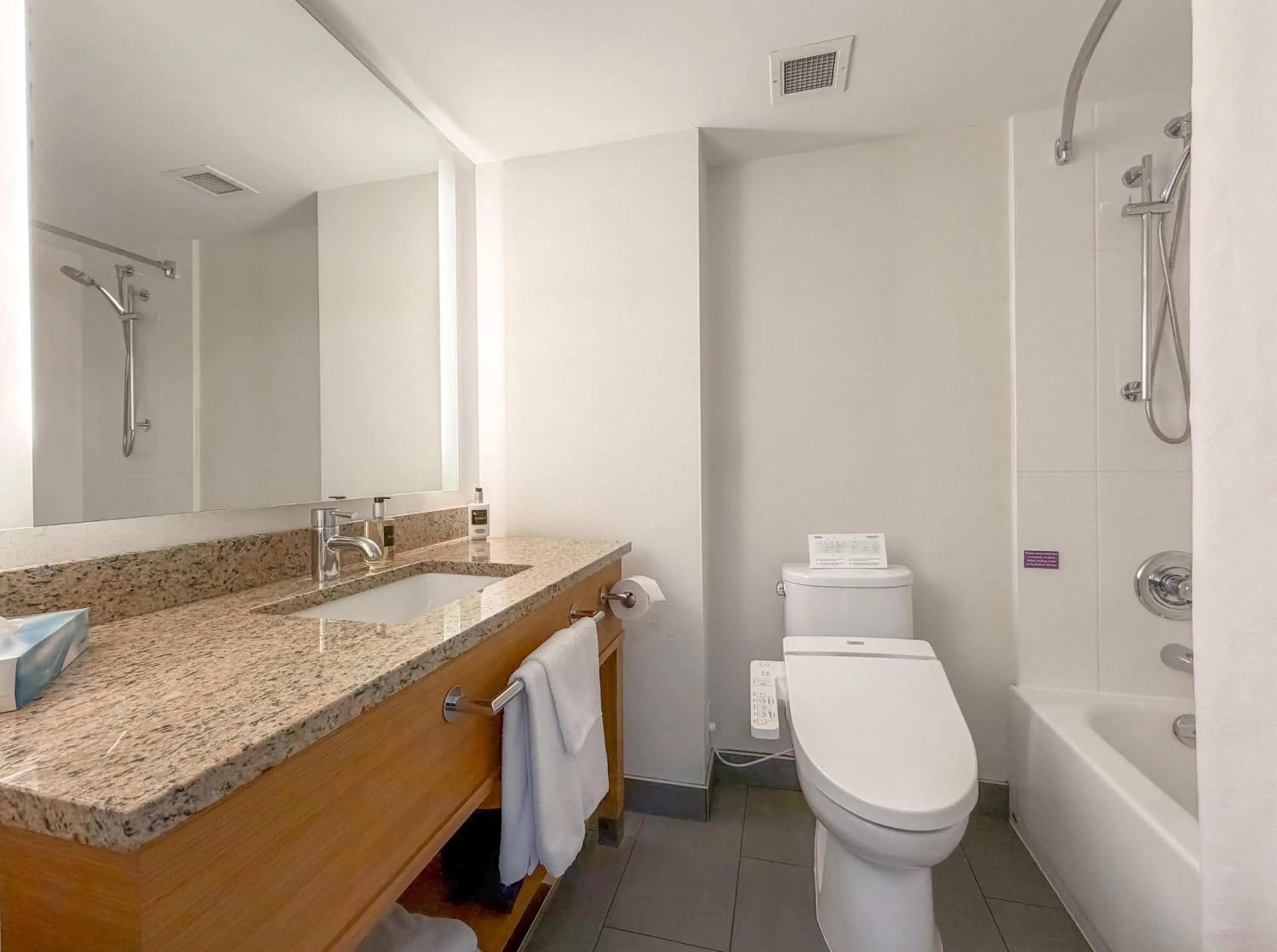 Bathroom in Coast Chilliwack Hotel by APA