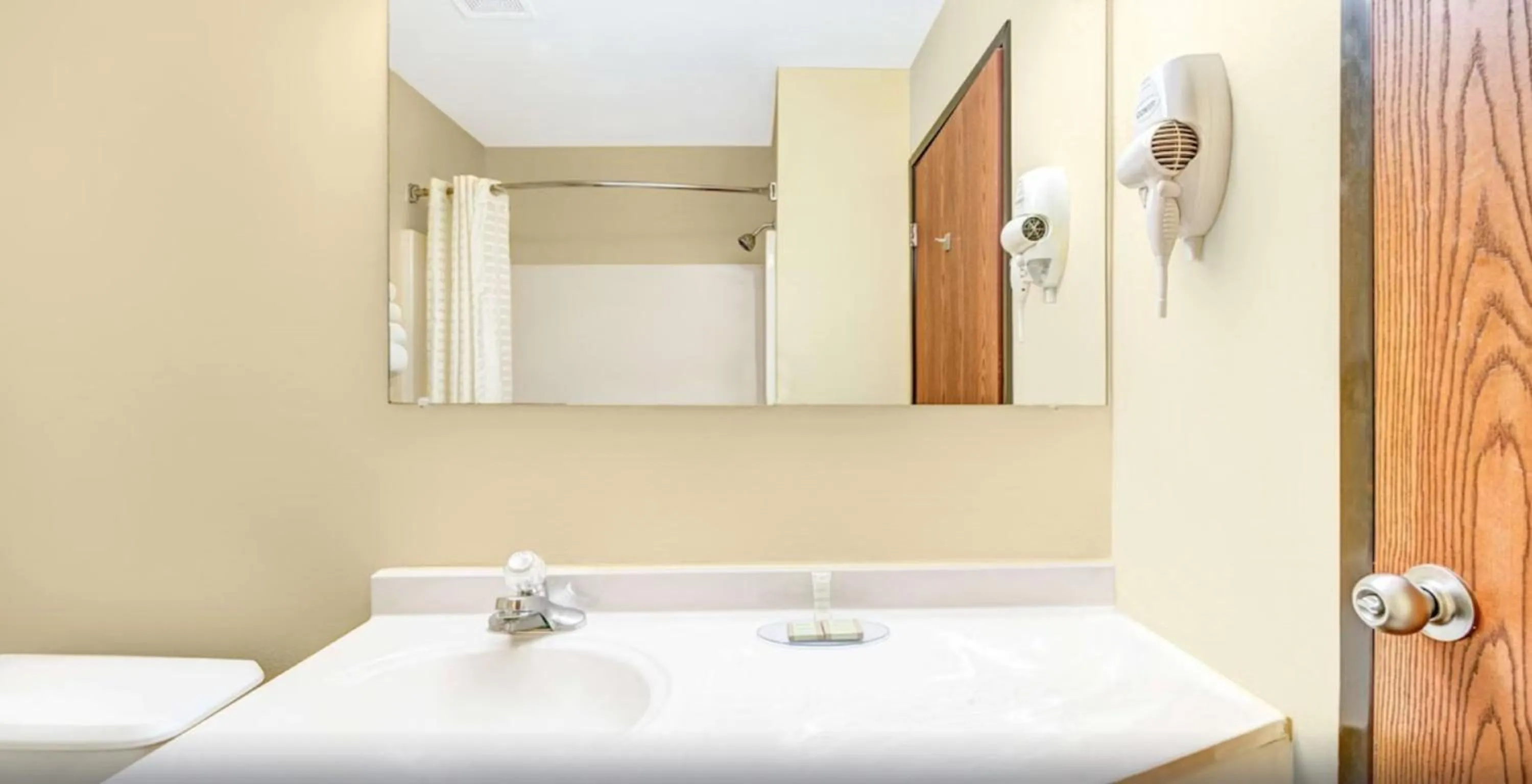 Bathroom in Super 8 by Wyndham McKinney/Plano Area
