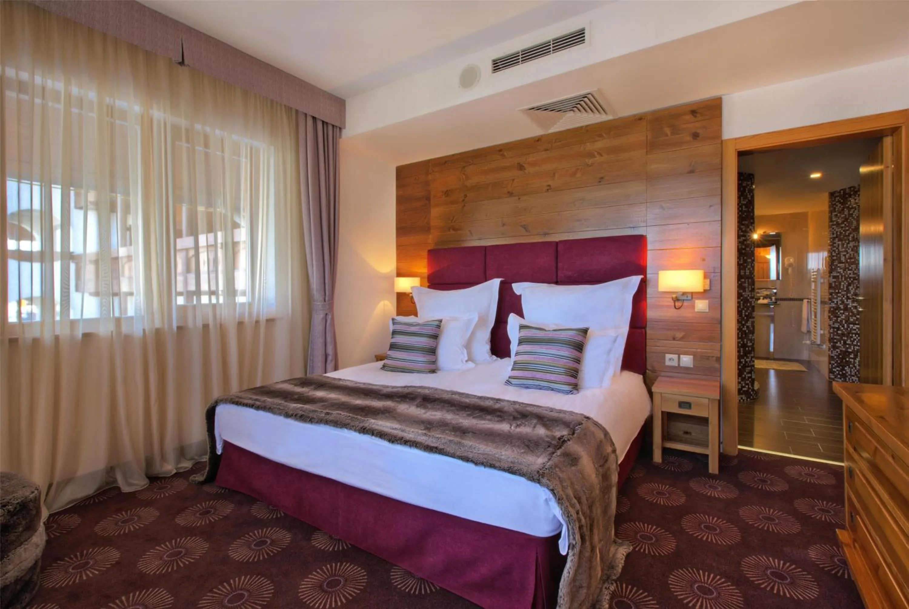 Photo of the whole room, Bed in Kempinski Hotel Grand Arena Bansko