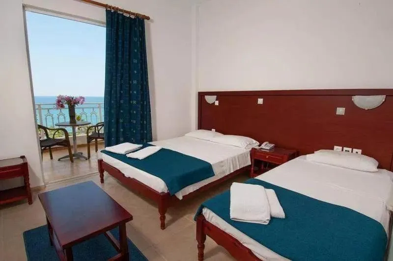 Bed in Poseidon Beach Hotel