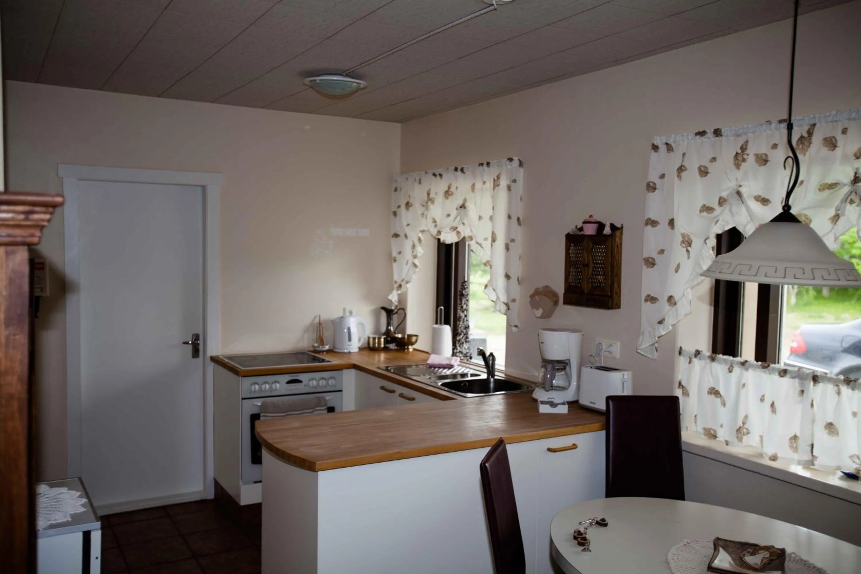 Communal kitchen in Mjóanes accommodation