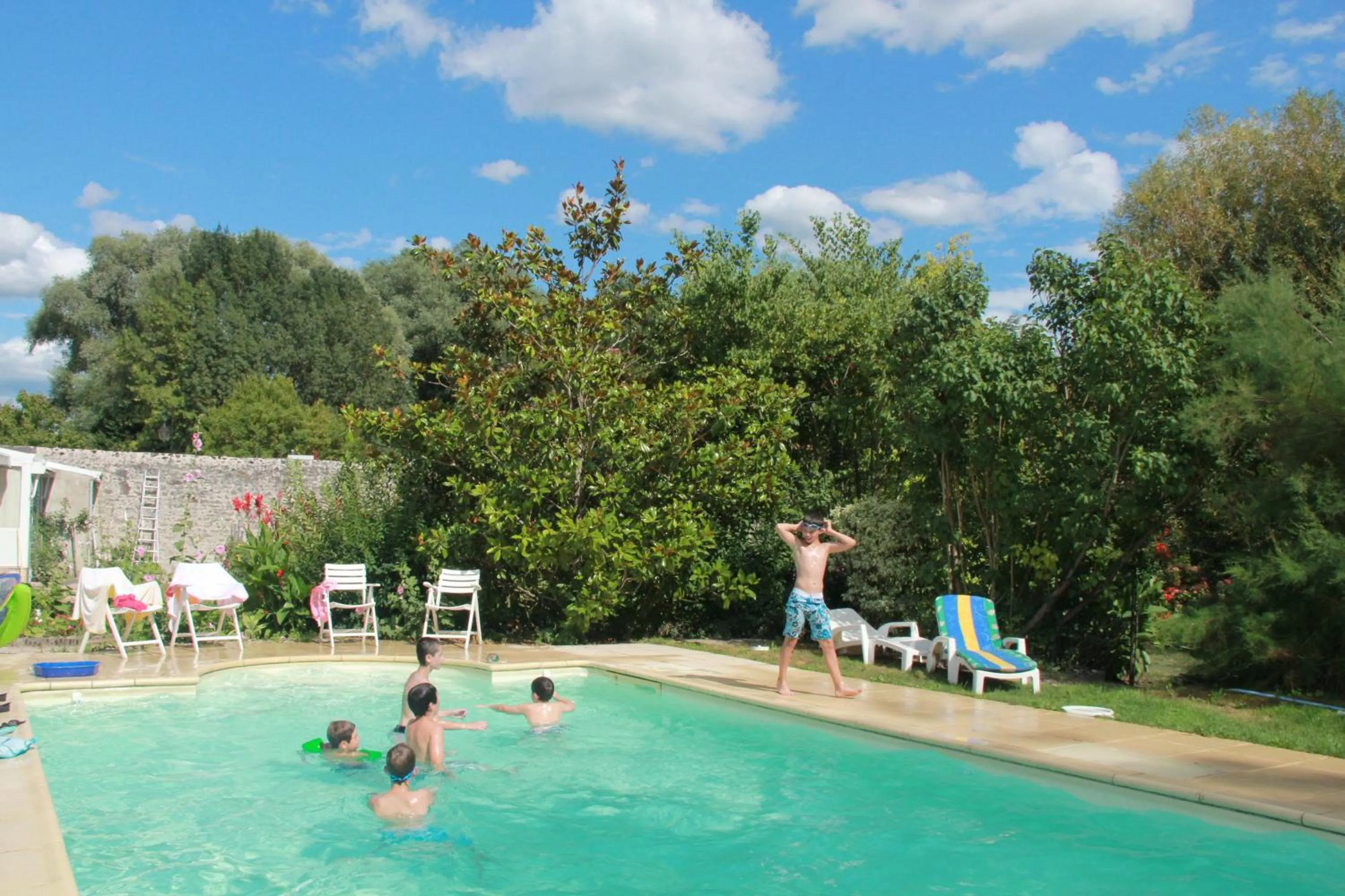 Swimming pool in Manoir le Bout du Pont-Chambres d'Hôtes