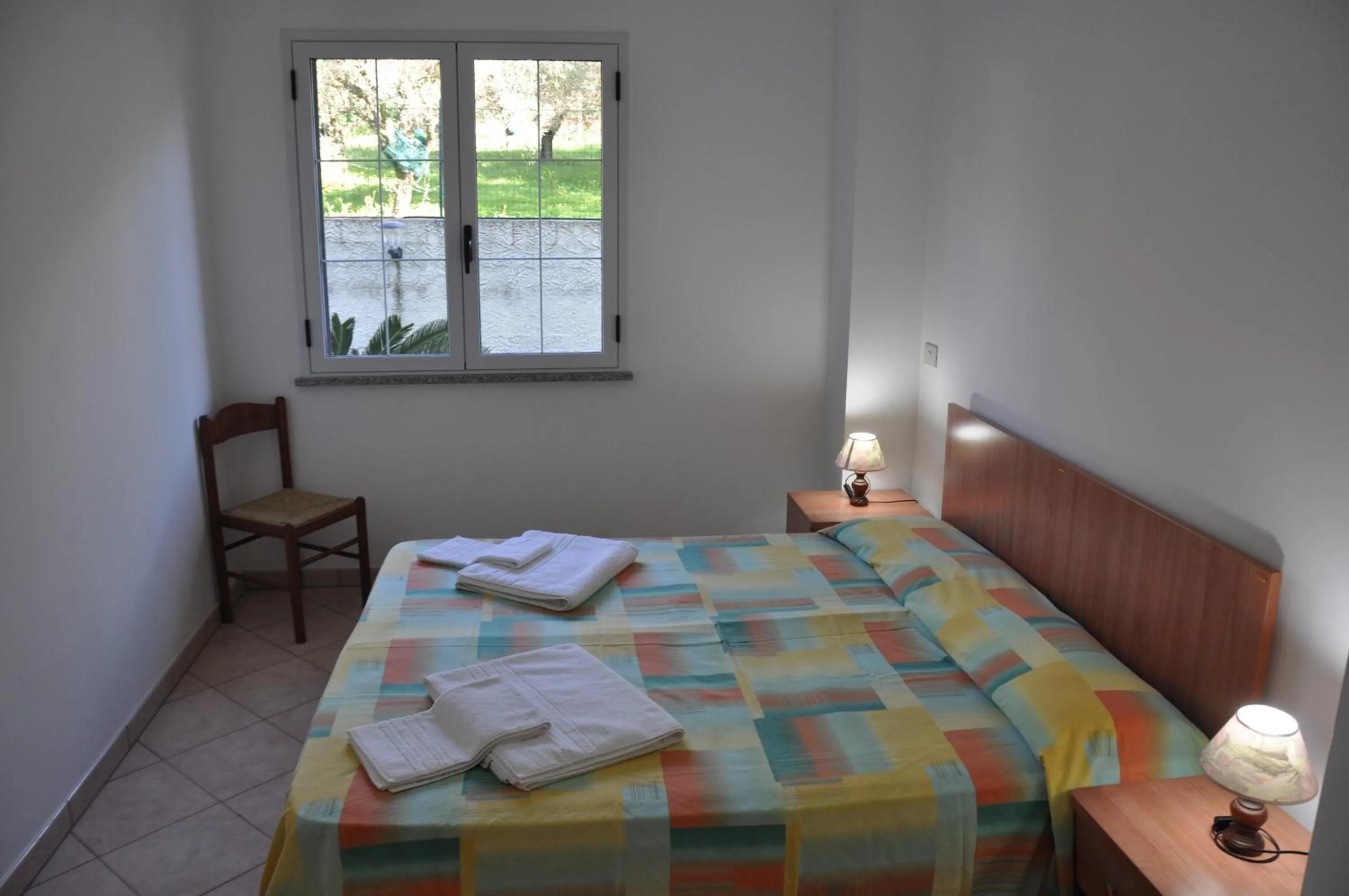 Bed in Rosy Hotel Residence