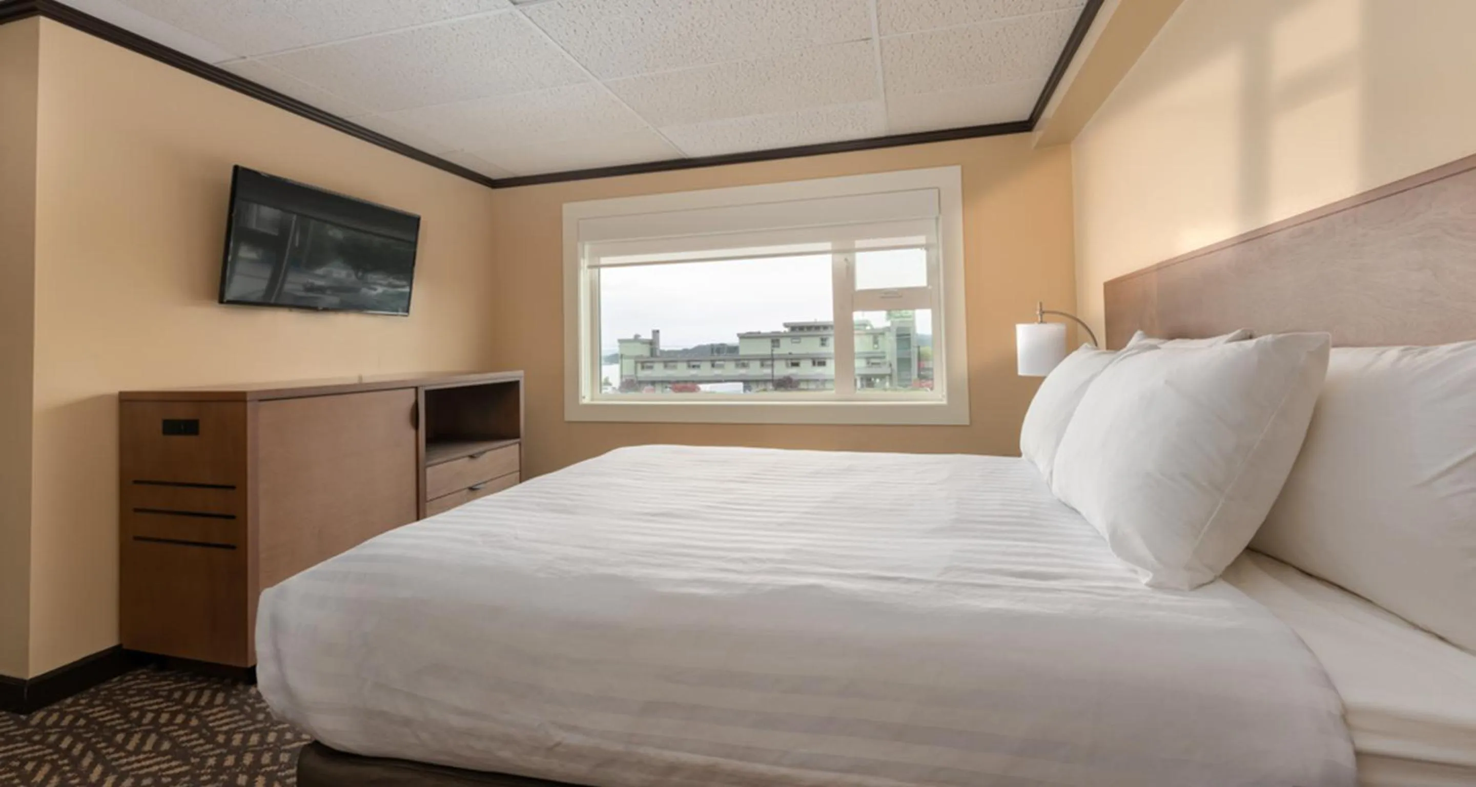 Bed in Prestige Oceanview Hotel Prince Rupert
