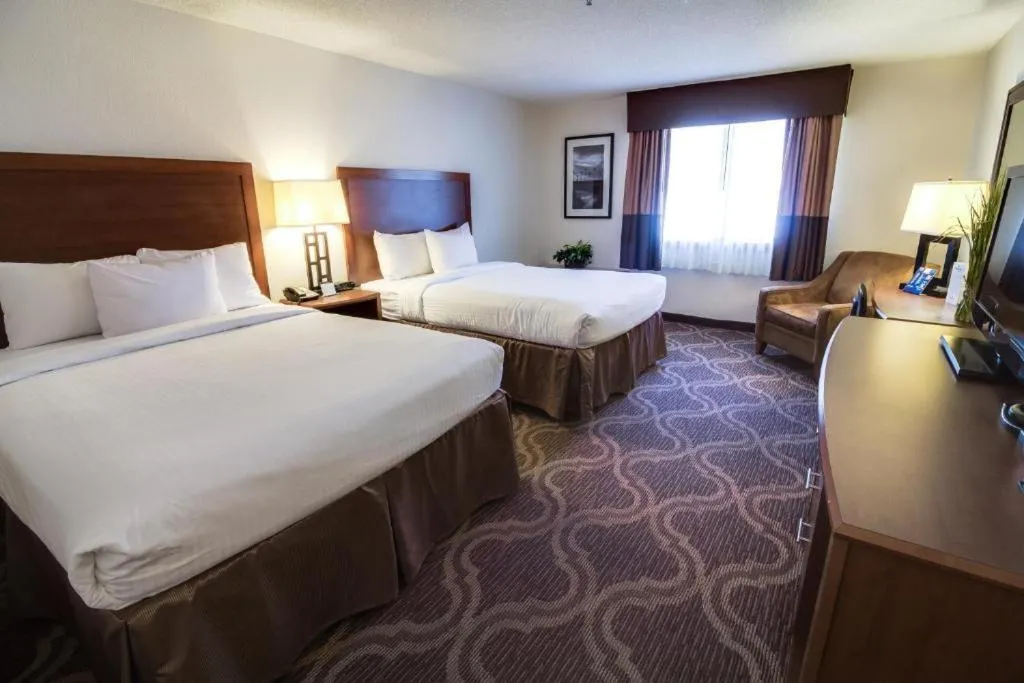 Bed in Ashmore Inn and Suites Lubbock