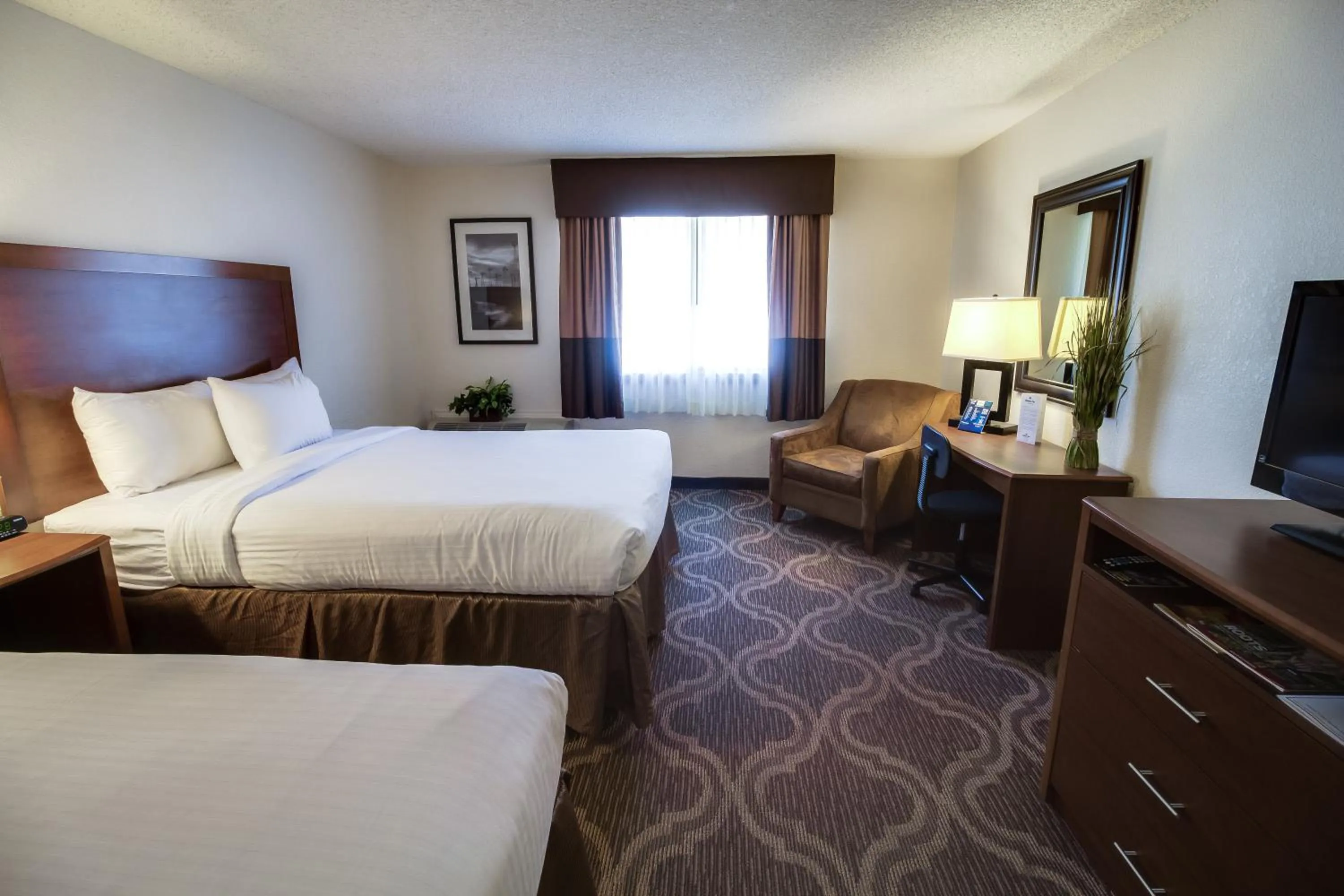 Bed in Ashmore Inn and Suites Lubbock