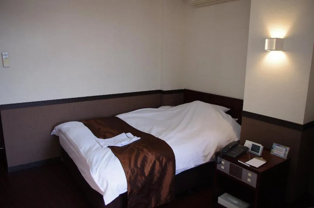 Bed in Hotel Saint Paul Nagasaki