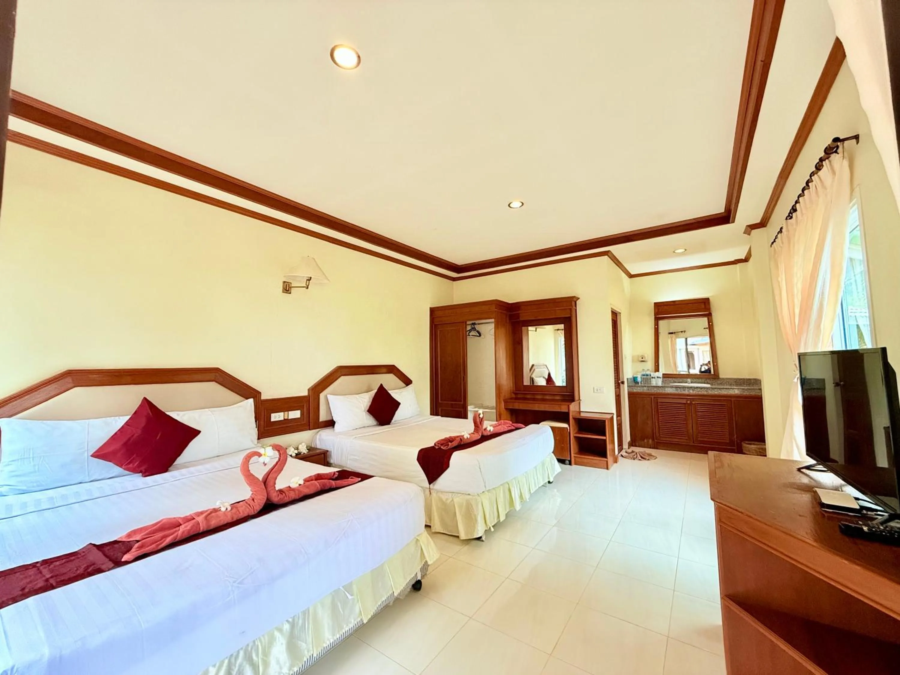 Bed in Lanta Palm Beach Resort , Beach Bungalow - Koh Lanta