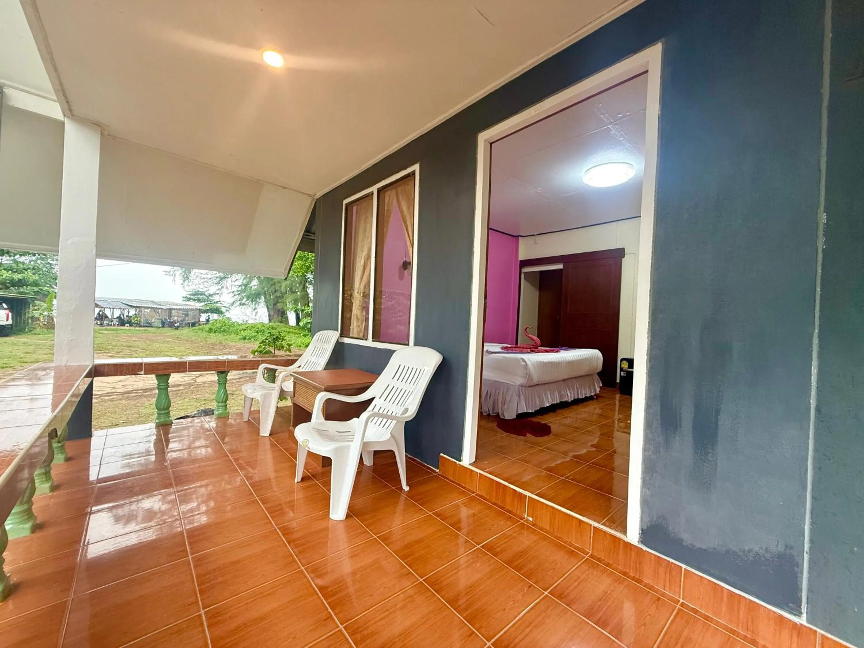 Bed in Lanta Palm Beach Resort , Beach Bungalow - Koh Lanta