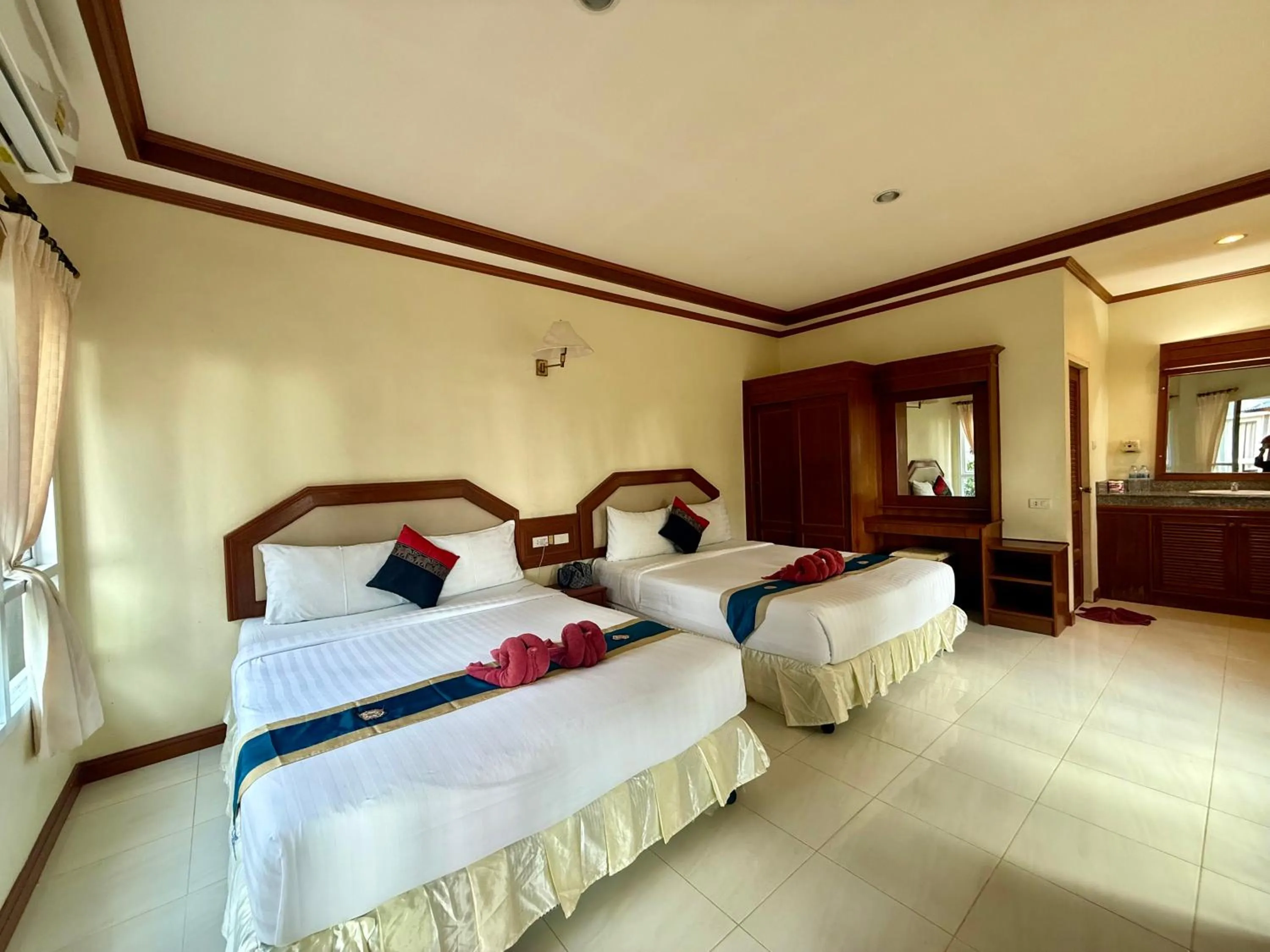 Bed in Lanta Palm Beach Resort , Beach Bungalow - Koh Lanta