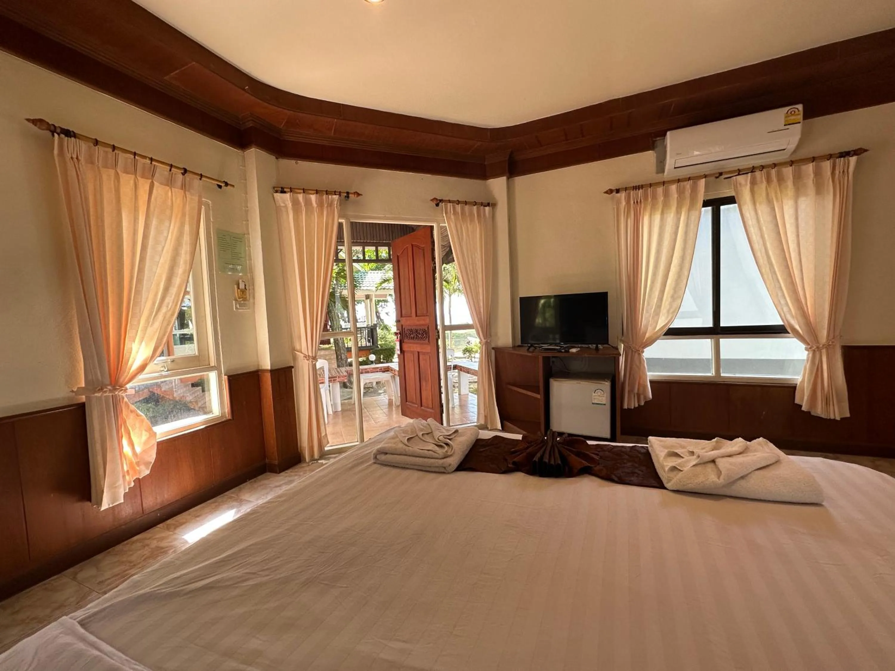 Photo of the whole room, Bed in Lanta Palm Beach Resort , Beach Bungalow - Koh Lanta