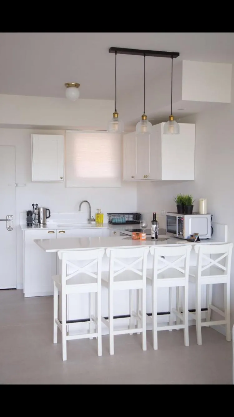 Kitchen or kitchenette in Suite Caesar - Neot Golf