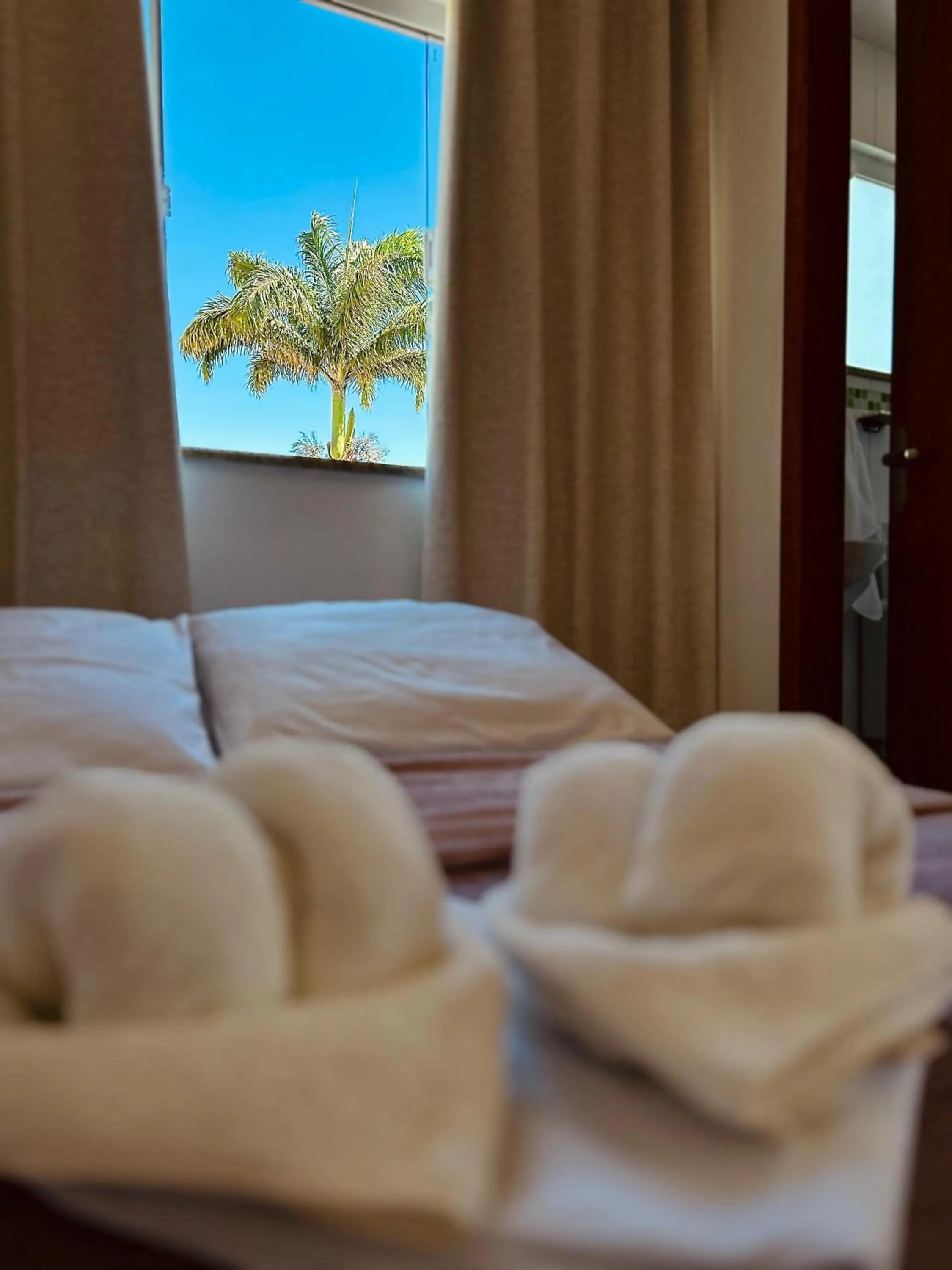 Bed in Bougainville Suítes