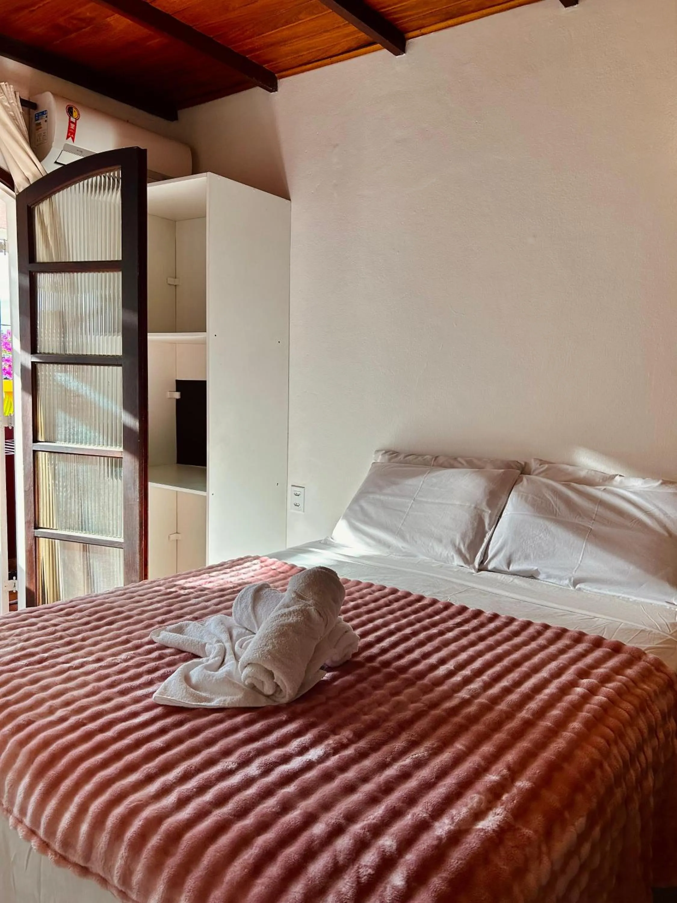 Bed in Bougainville Suítes