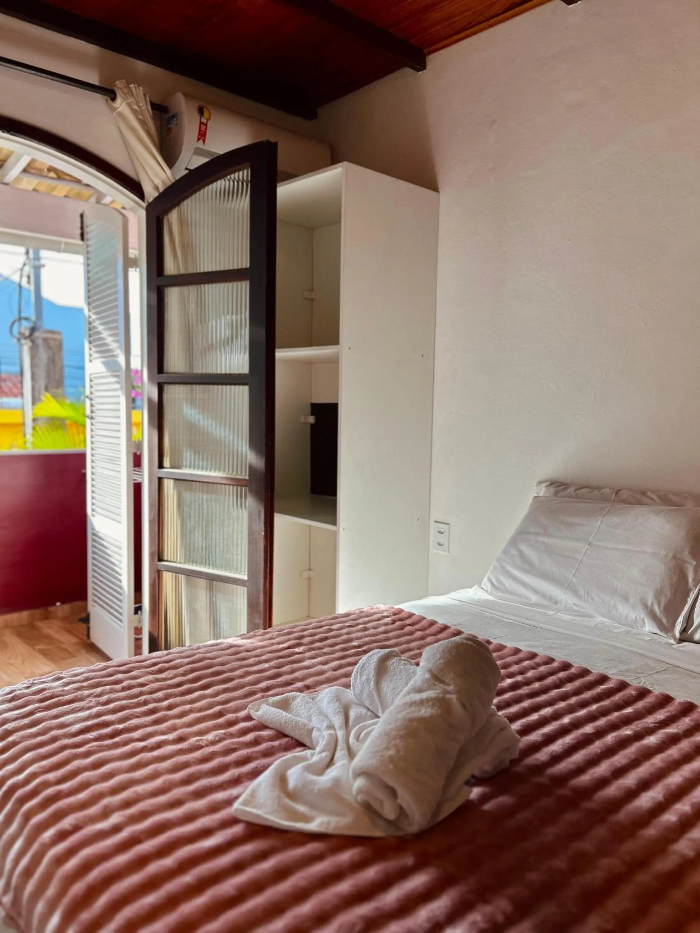 Bed in Bougainville Suítes