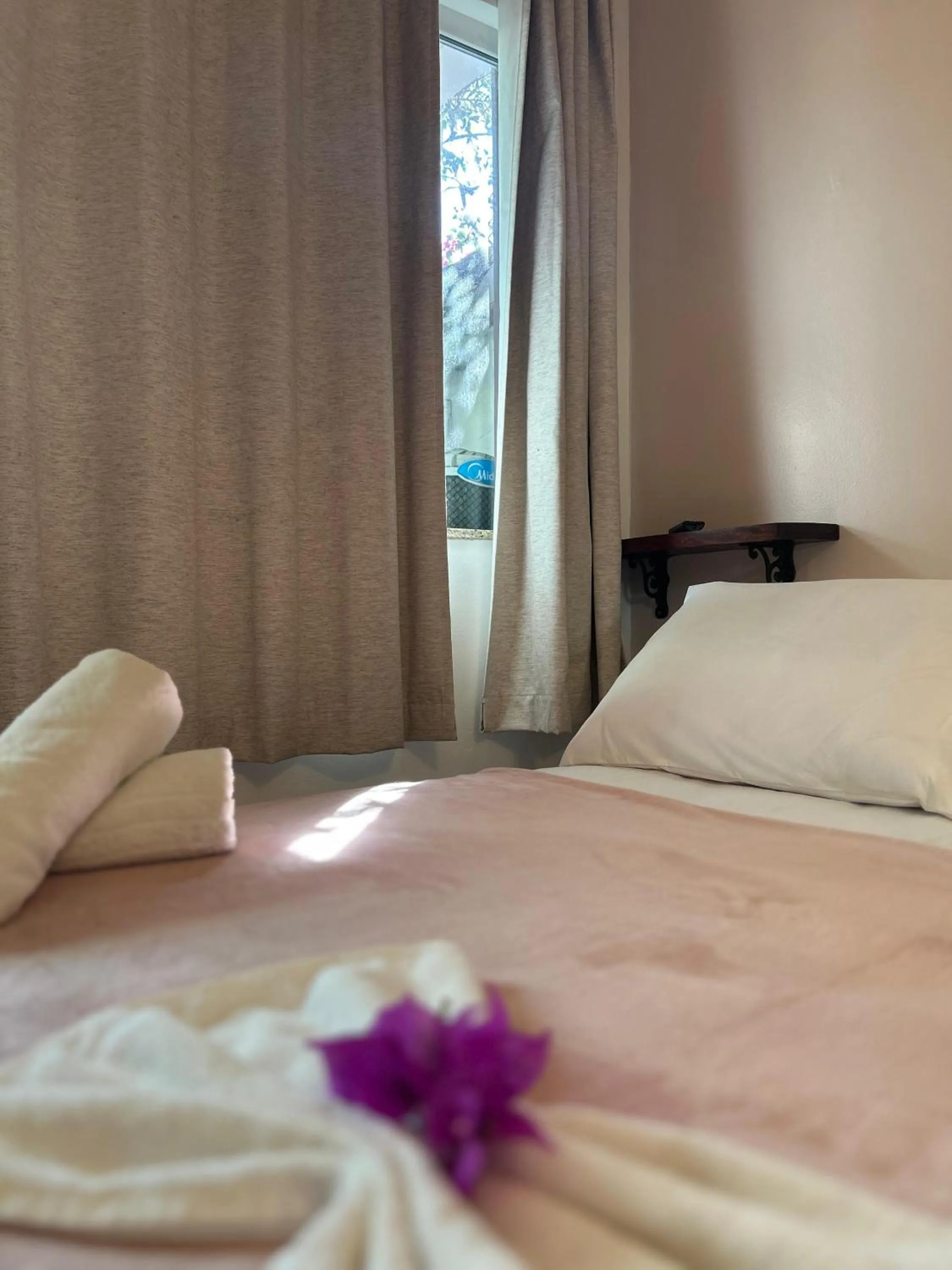 Bed in Bougainville Suítes