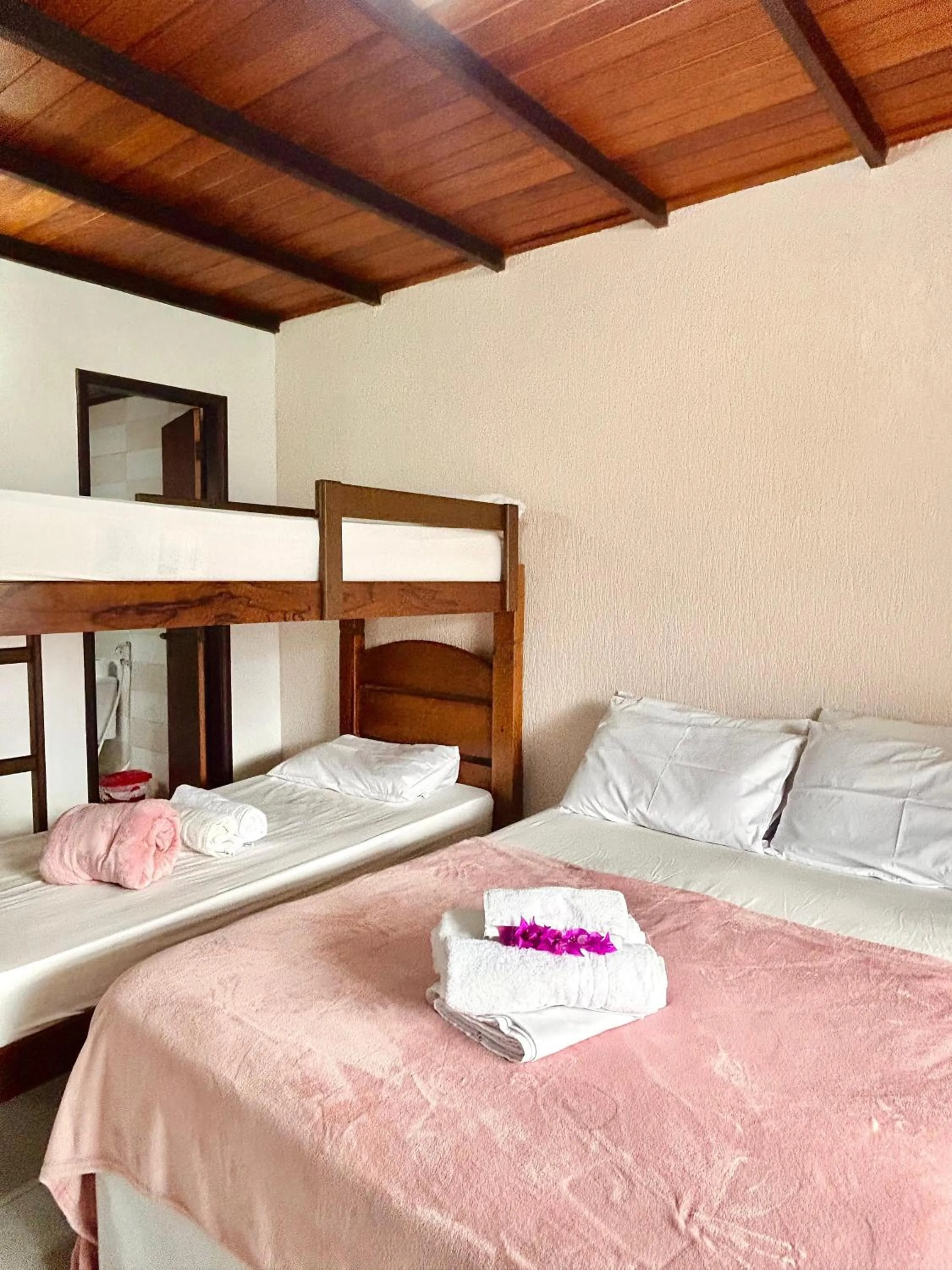 Bed in Bougainville Suítes