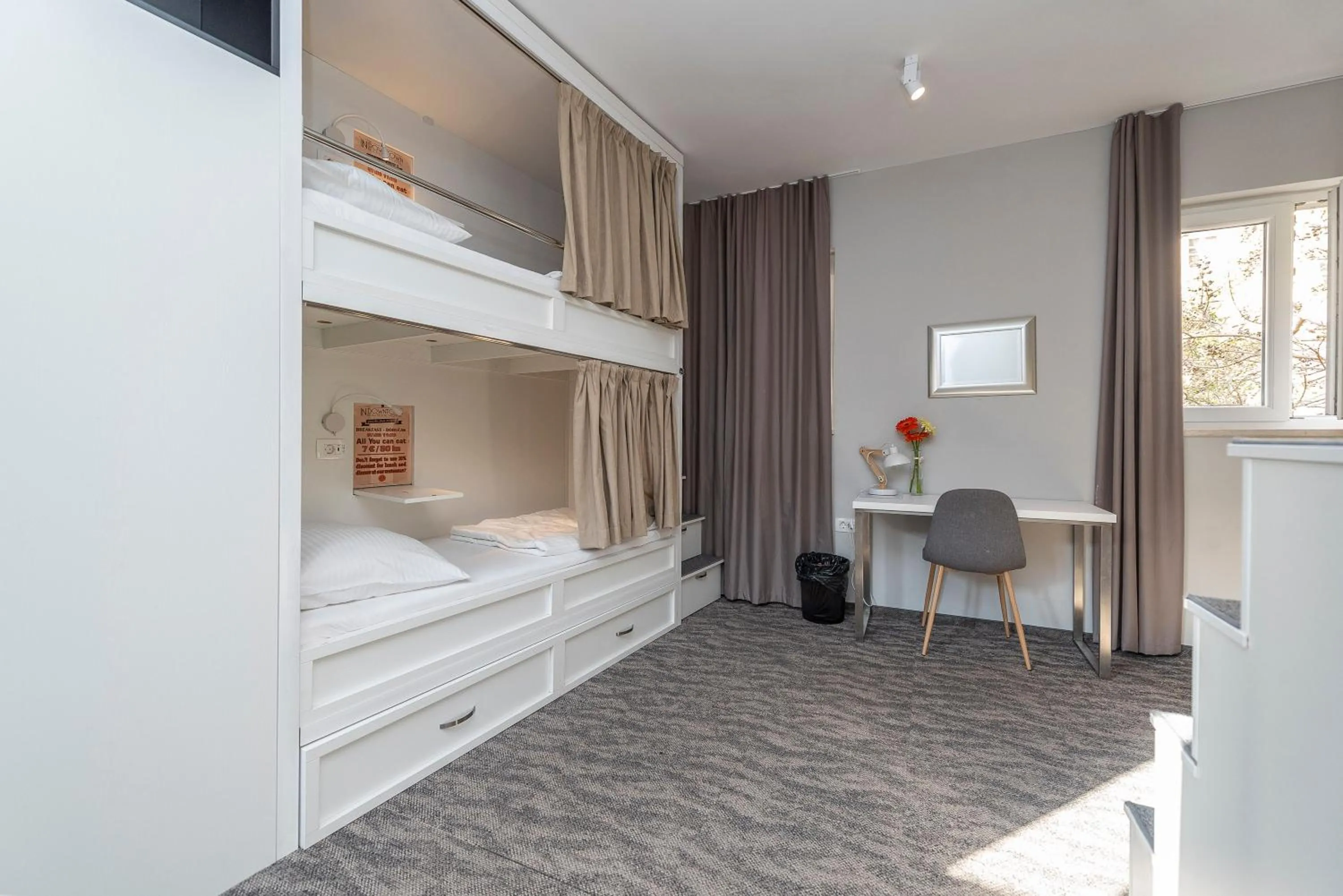 Seating area, Bed in Downtown Boutique Hostel